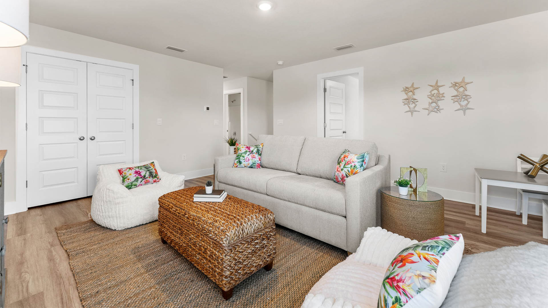 Upstairs common area with closet and bedroom entrances.