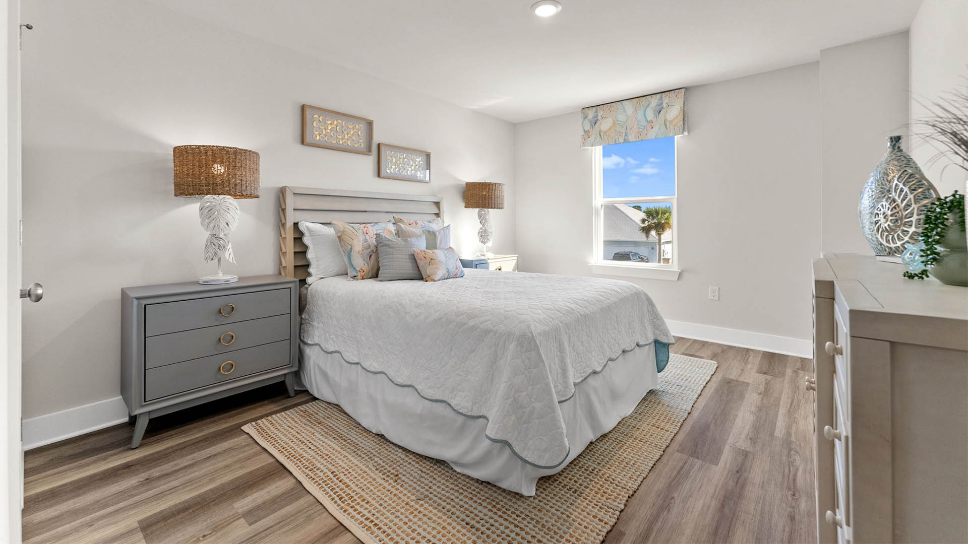 Bedroom with EVP flooring and window.