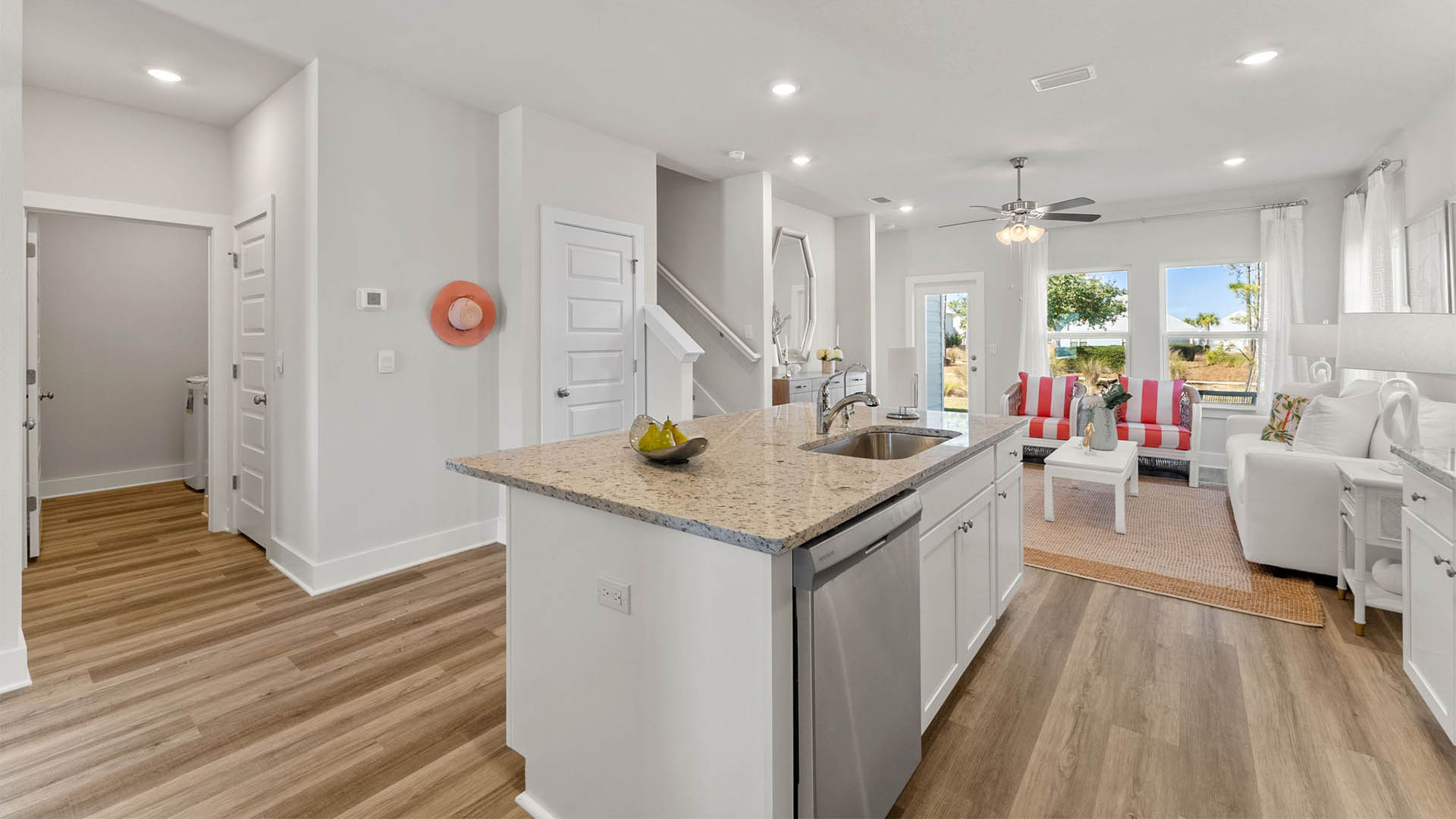 Kitchen and living room and stairs and back door.