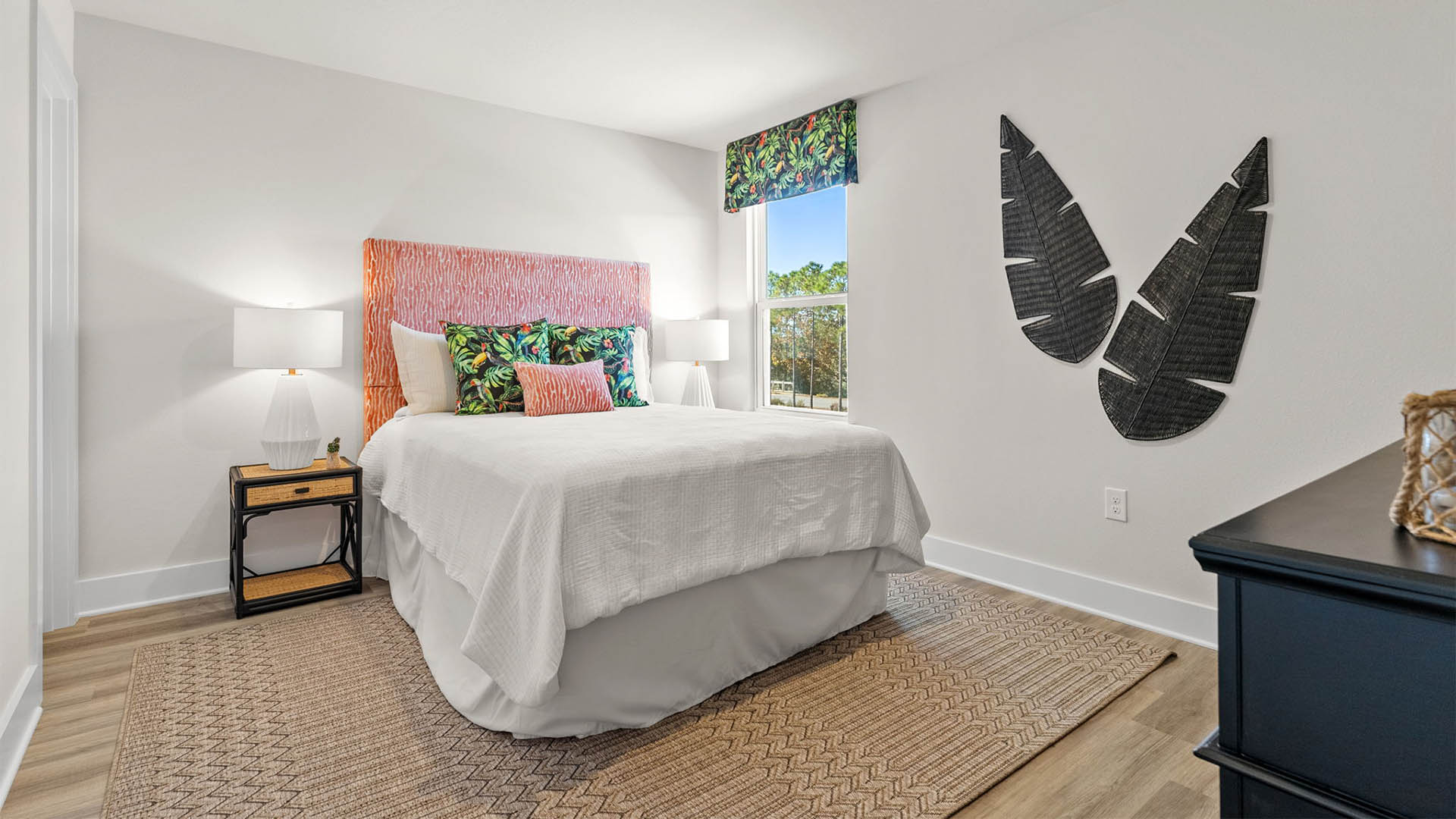Bedroom with EVP flooring and window.