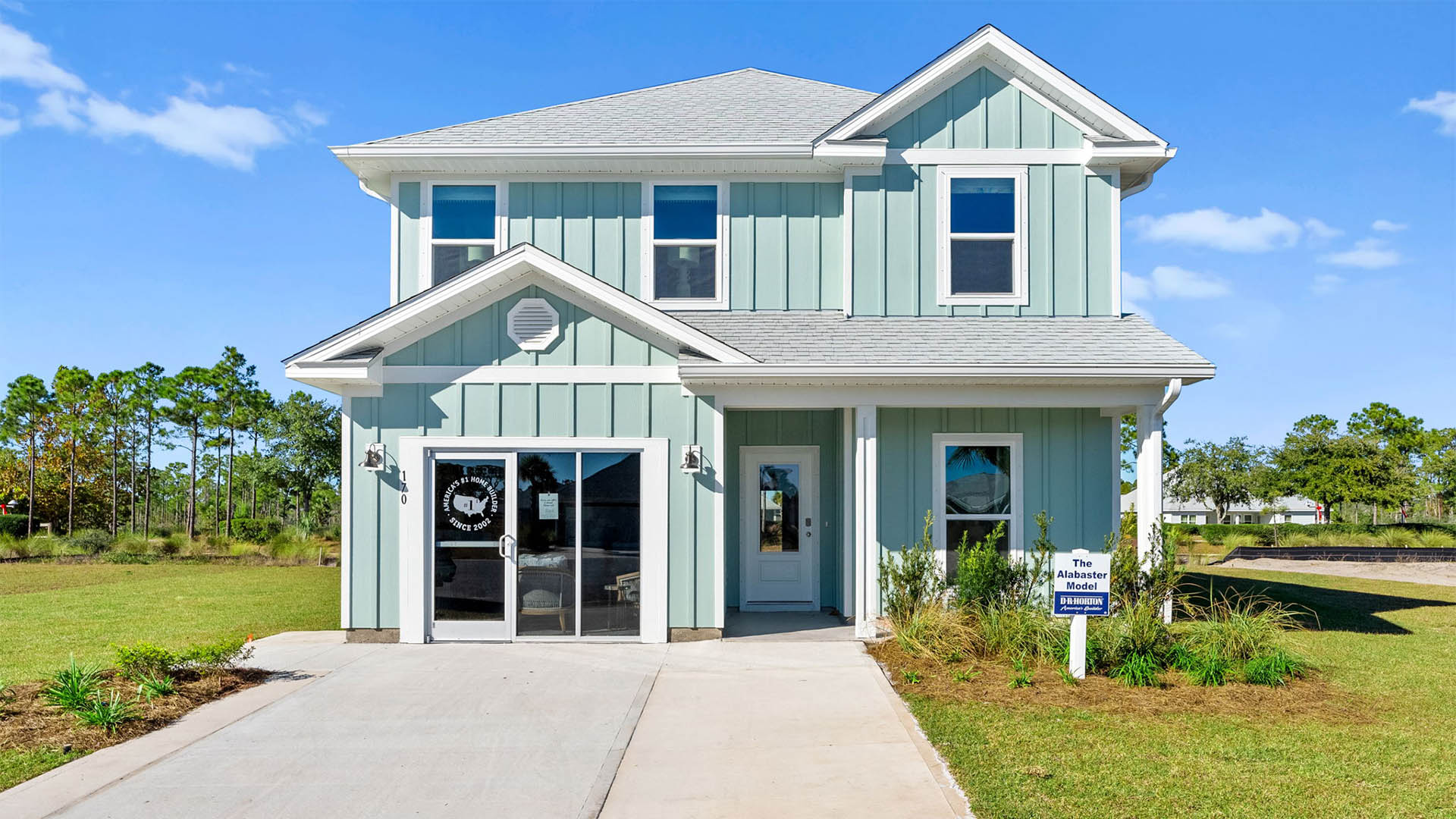 Alabaster floor plan at WindMark Beach with Hardie siding and covered front porch and single car garage.