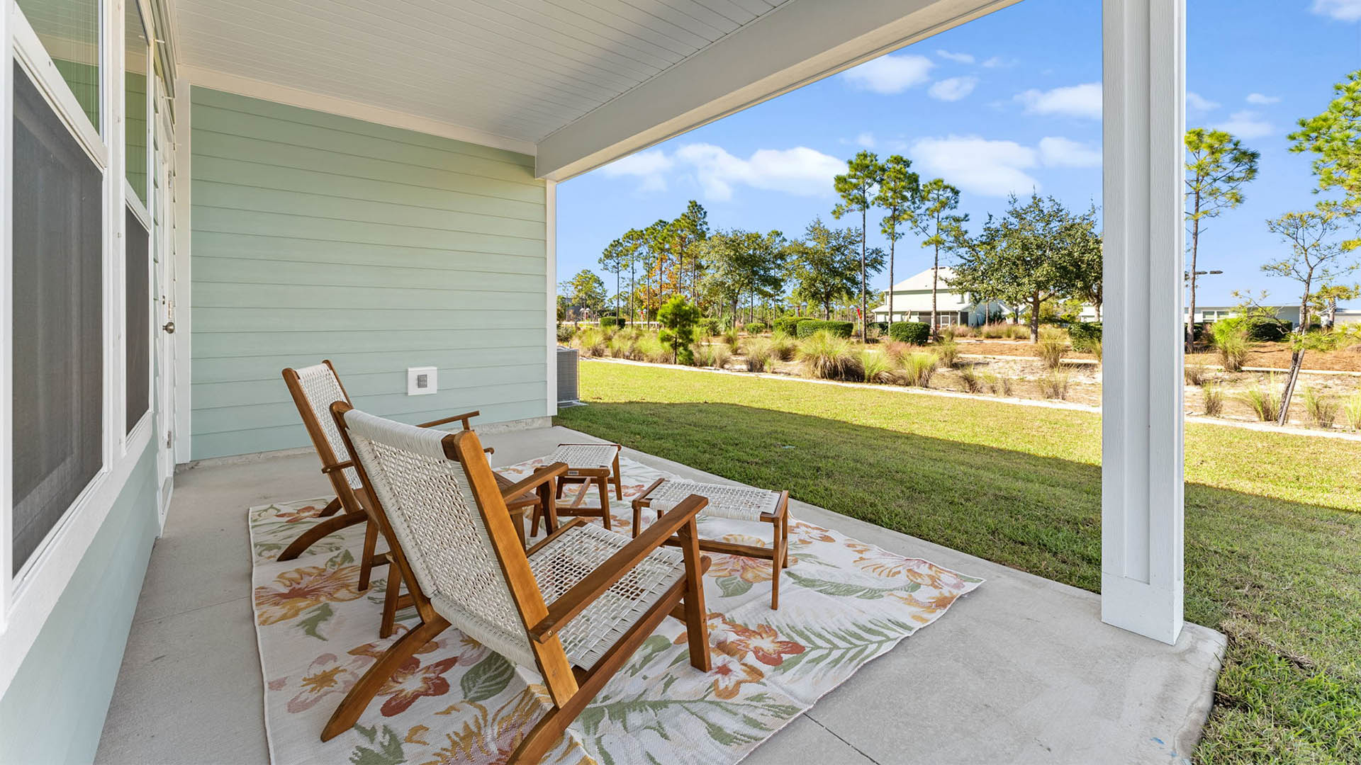 Covered rear patio of Alabaster floor plan at WindMark Beach.