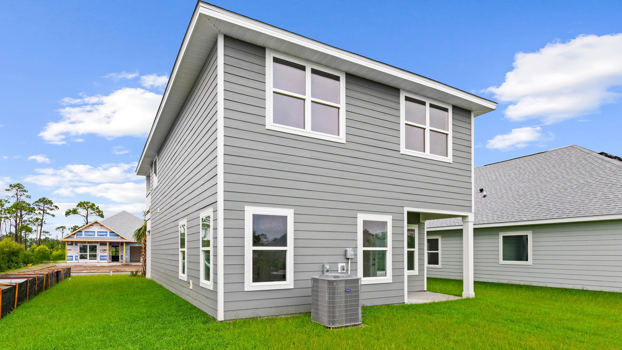 Monroe floor plan at WindMark Beach rear of home with covered rear patio.