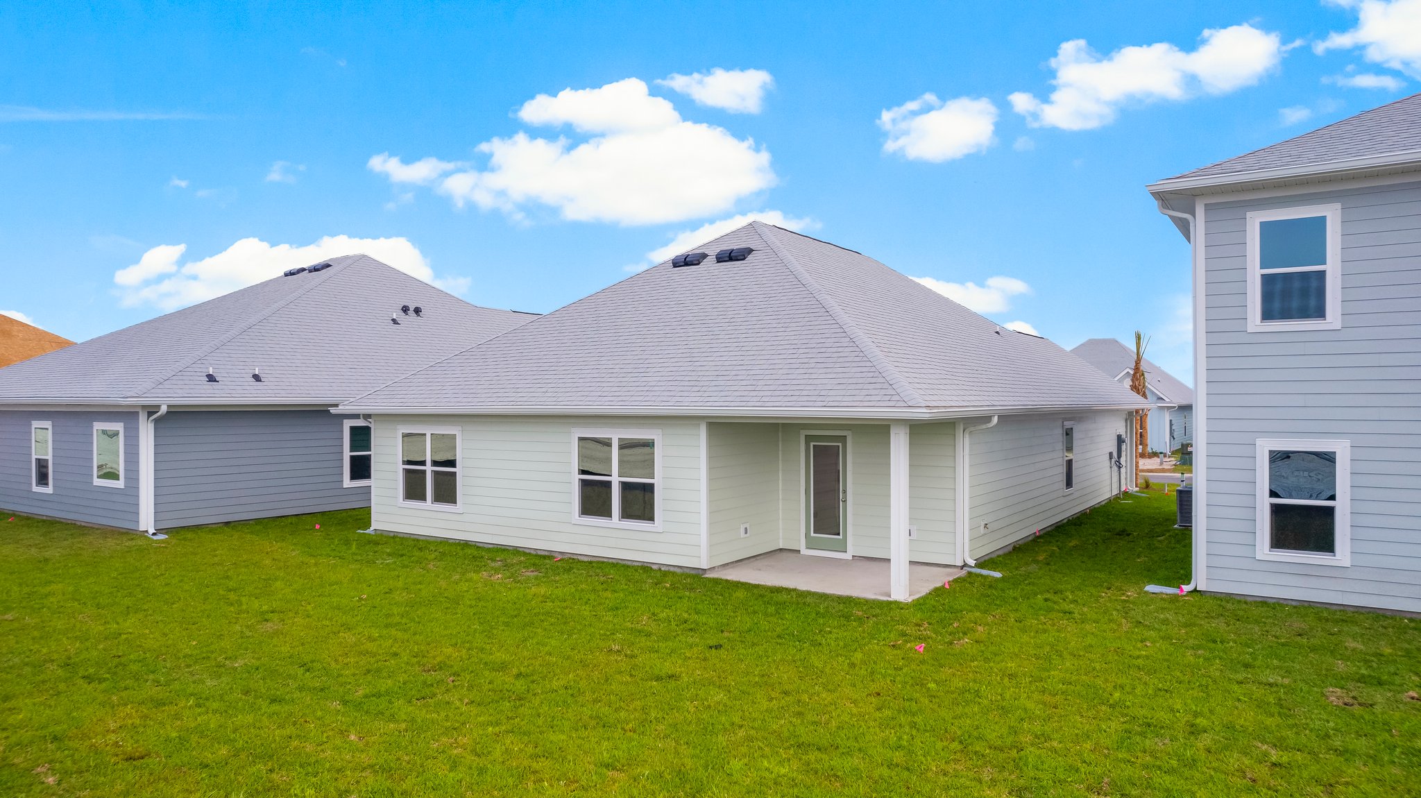 Rhett floor plan at WindMark Beach rear of home with covered pack patio.