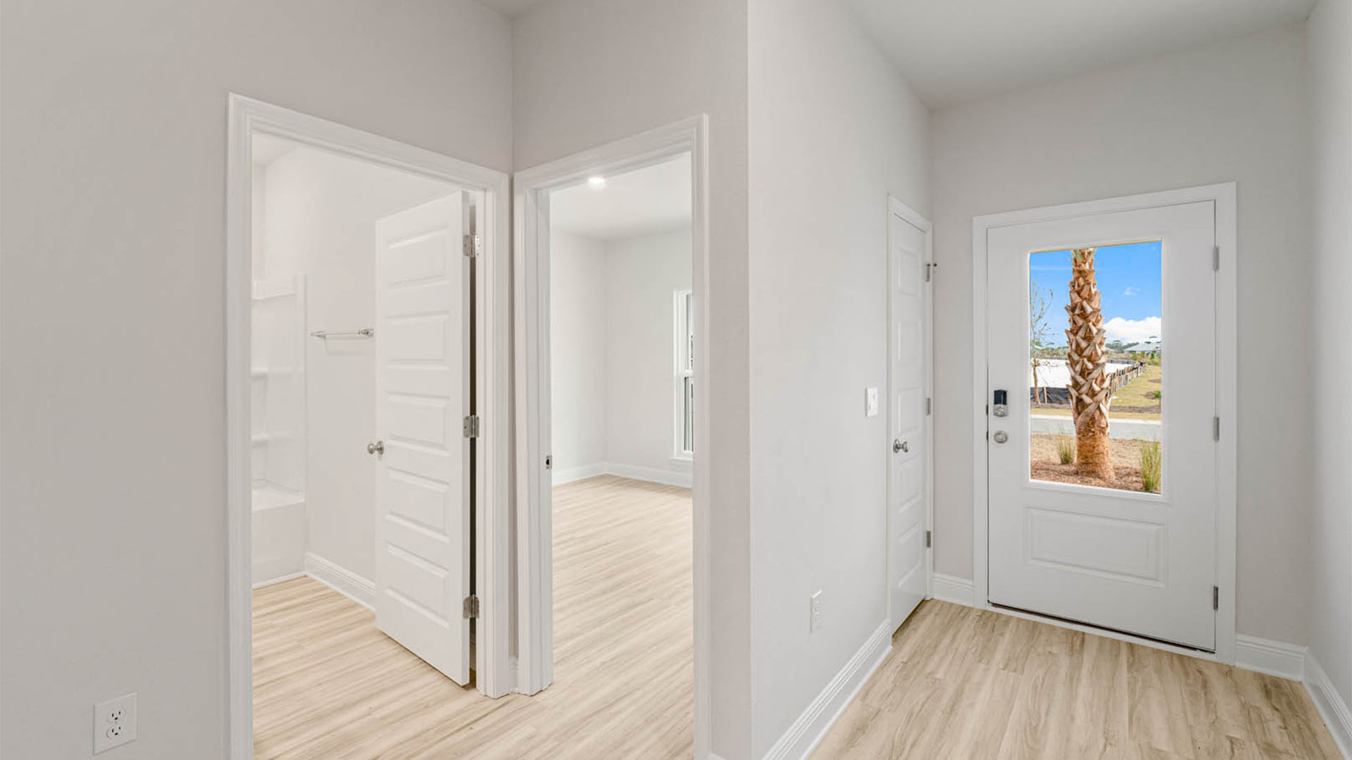 Front door entrance next to bedrooms and guest bathroom.