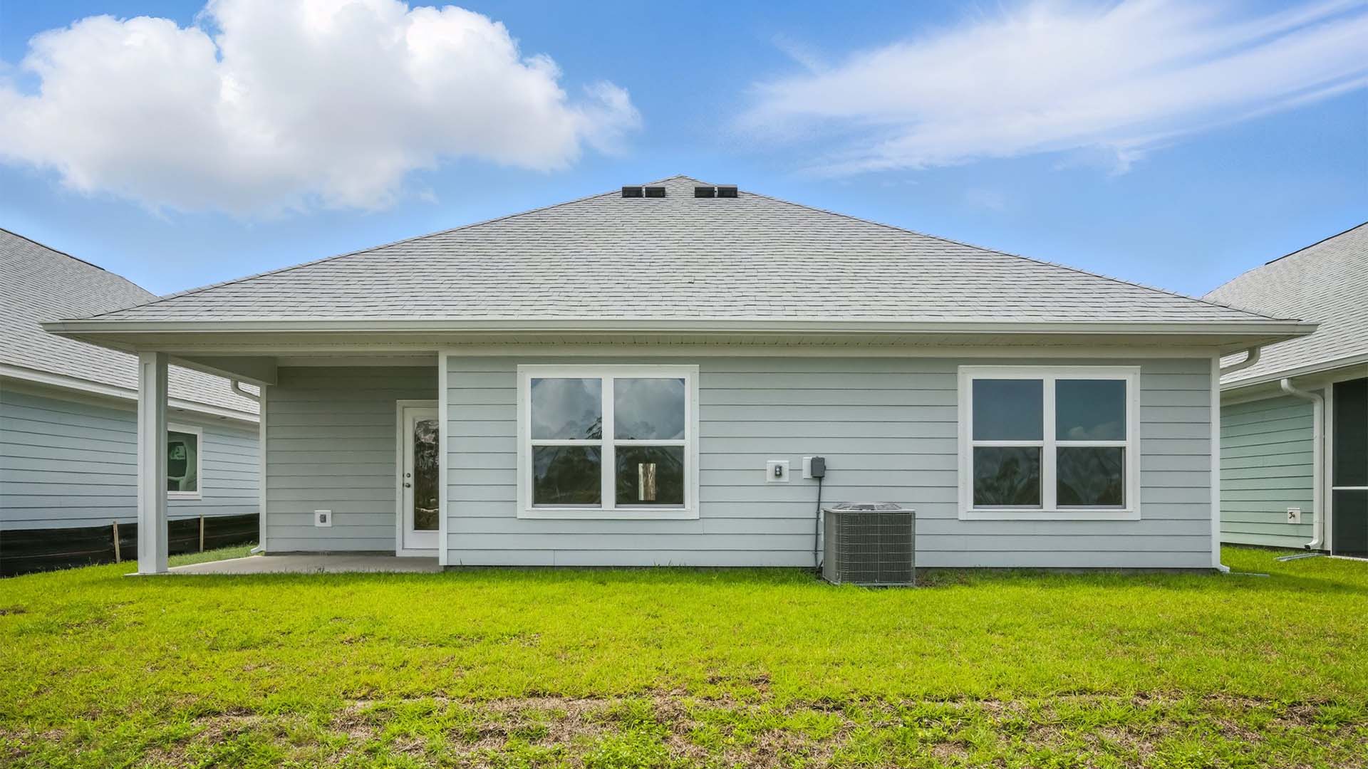 Rhett floor plan at WindMark Beach rear of home with covered pack patio.