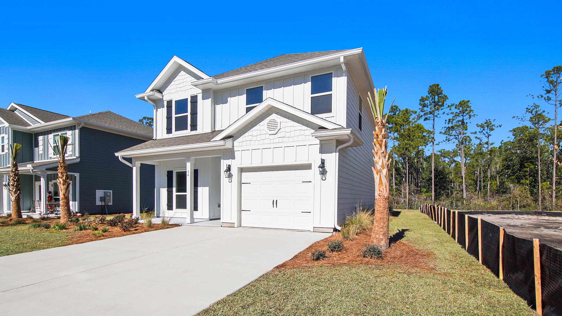 Alabaster floor plan at WindMark Beach with Hardie siding and covered front porch and single car garage.