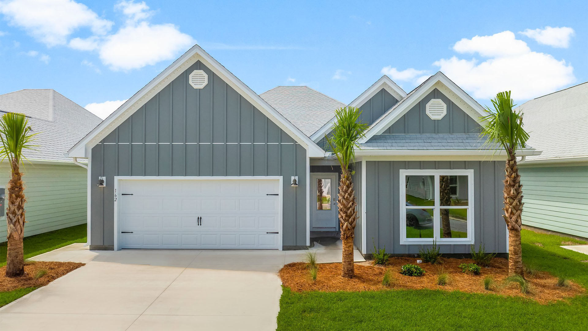 Kennedy floor plan at WindMark Beachfront of home with two-car garage and Hardie Board siding.
