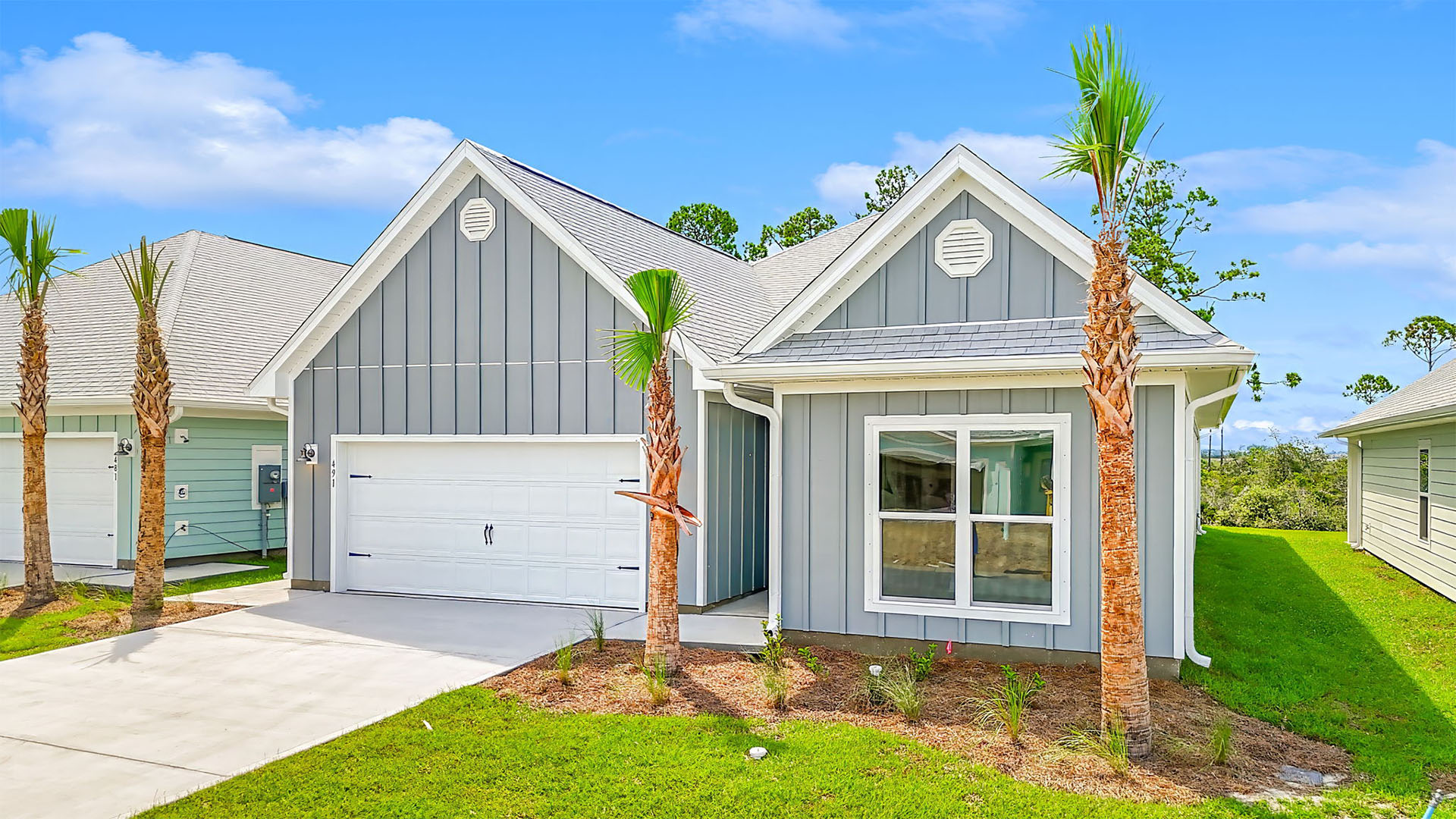 Kennedy floor plan at WindMark Beachfront of home with two-car garage and Hardie Board siding.