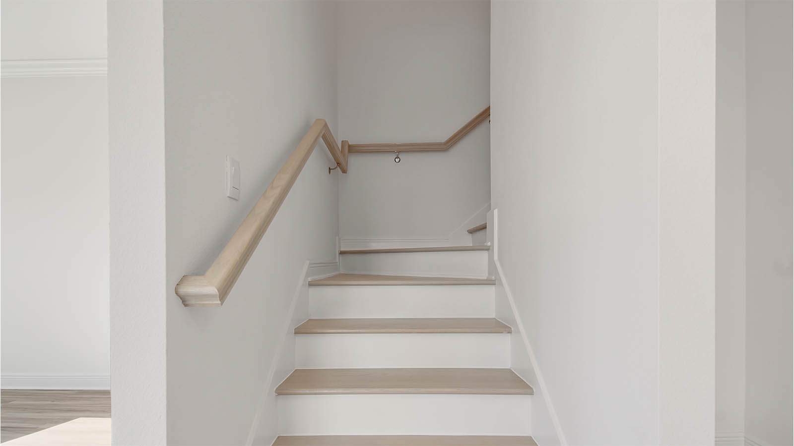 Stairs with wooden paneling.