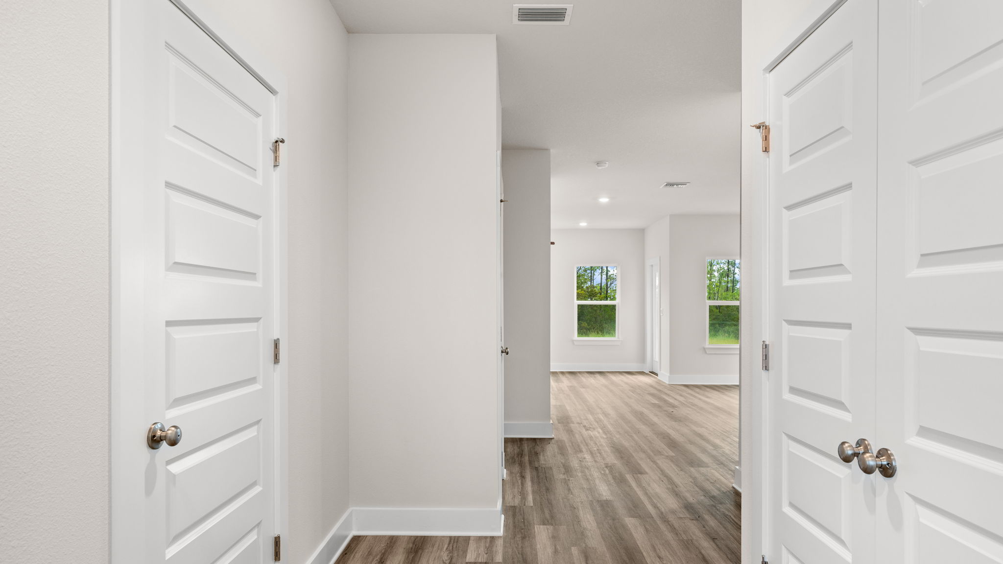 Front foyer with EVP flooring and closet.