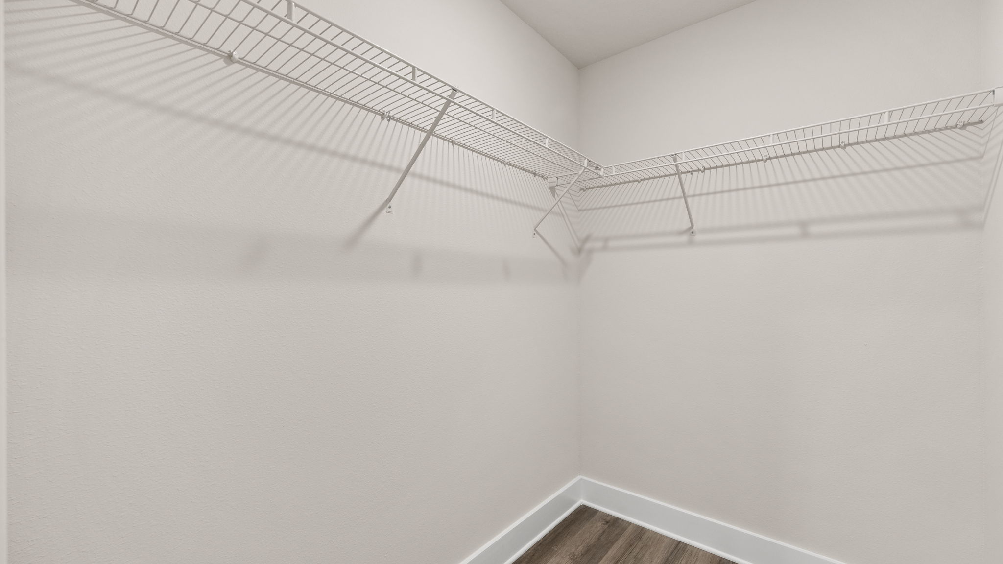 Closet with EVP flooring and shelving.