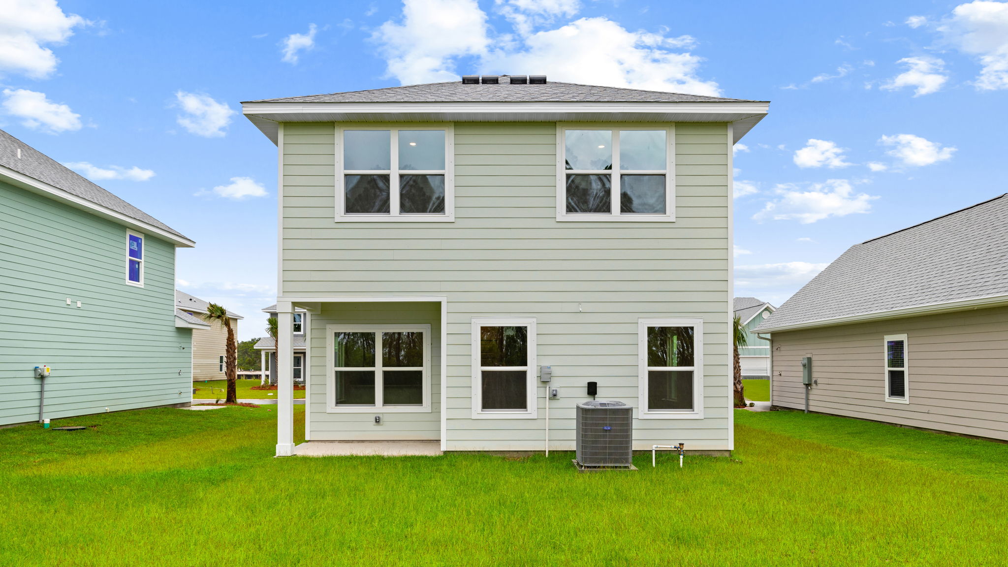 Monroe floor plan at WindMark Beach rear of home with covered rear patio.