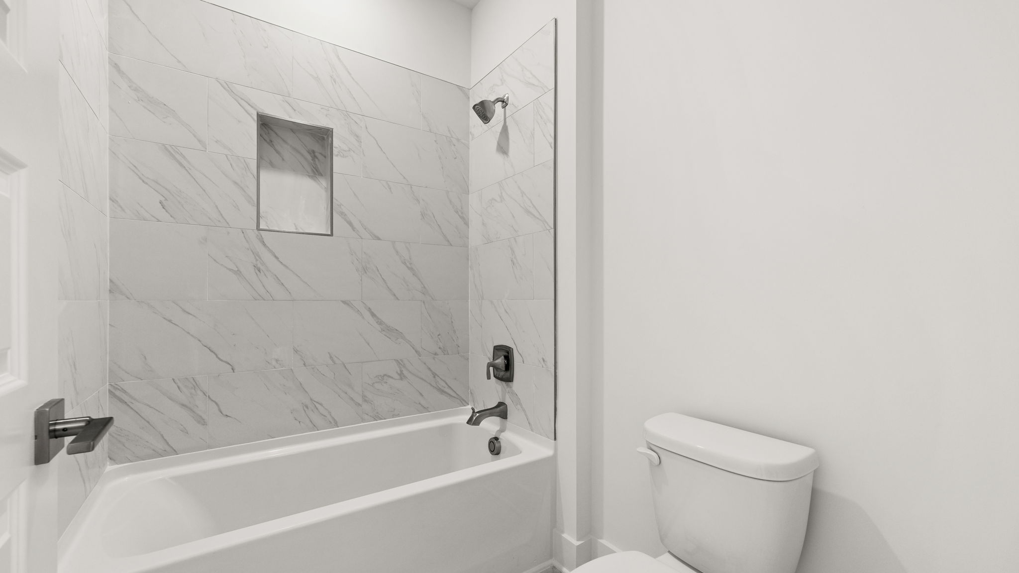 Tile tub and toilet.
