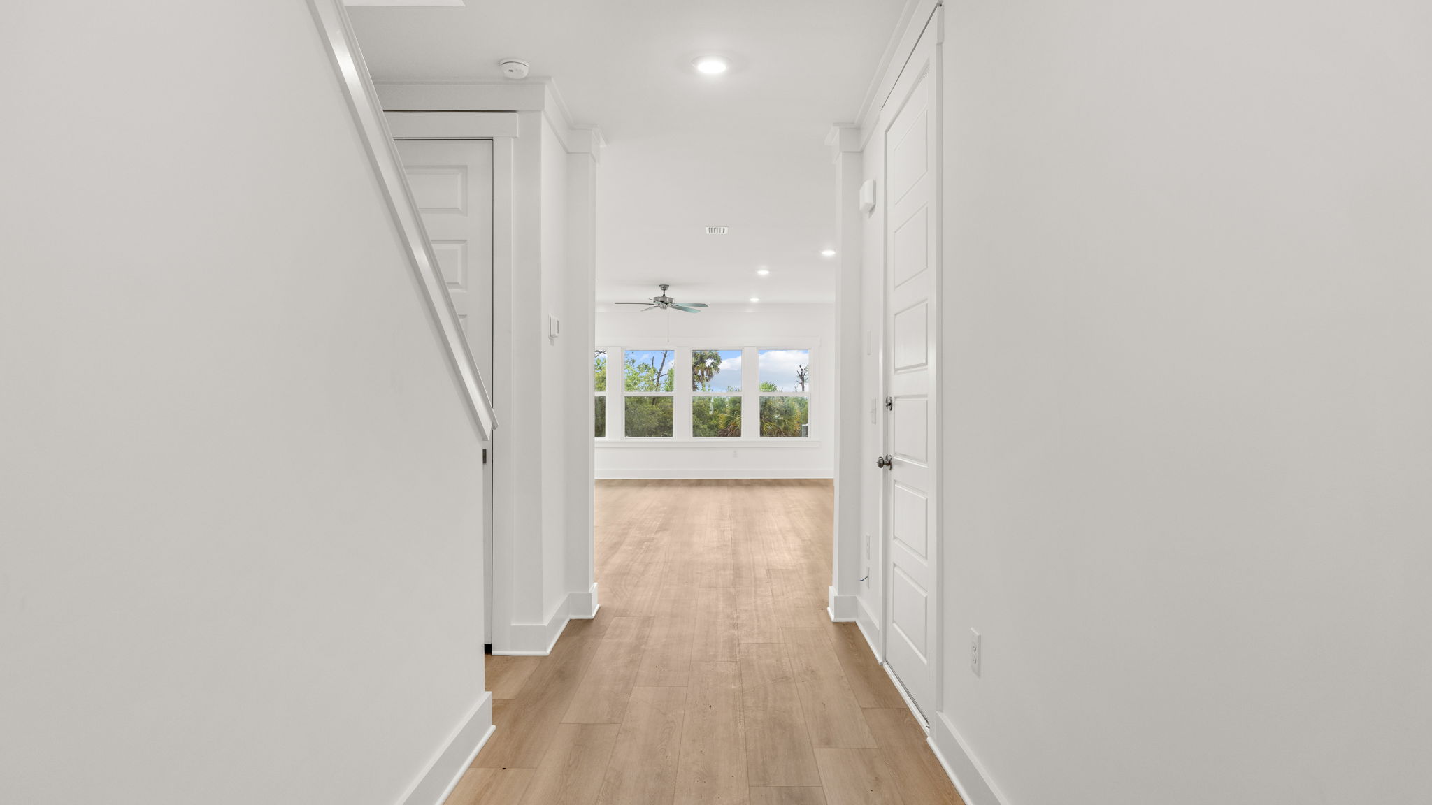 Front entrance next to stairs and garage door.