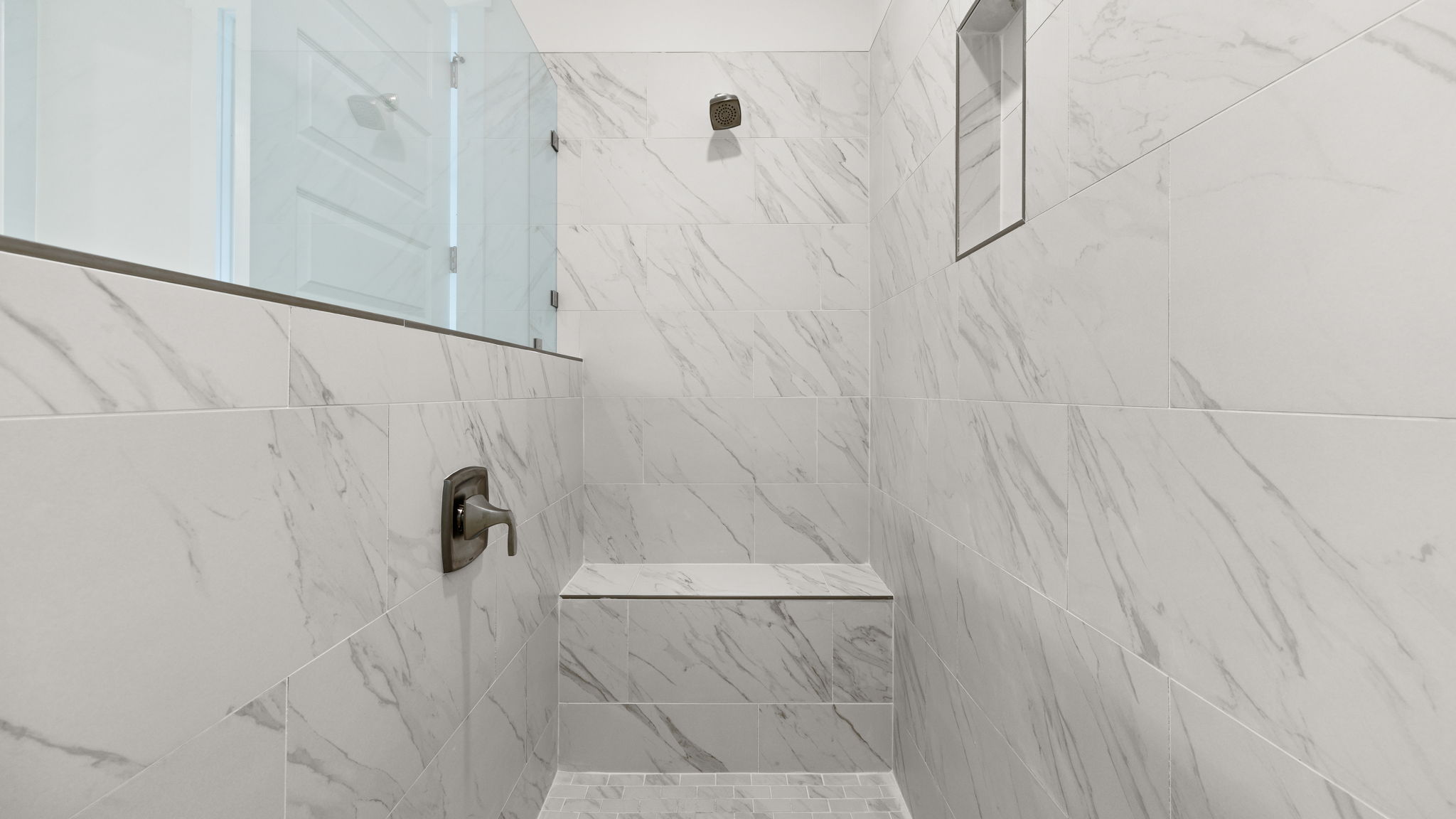 Tile shower with seat.