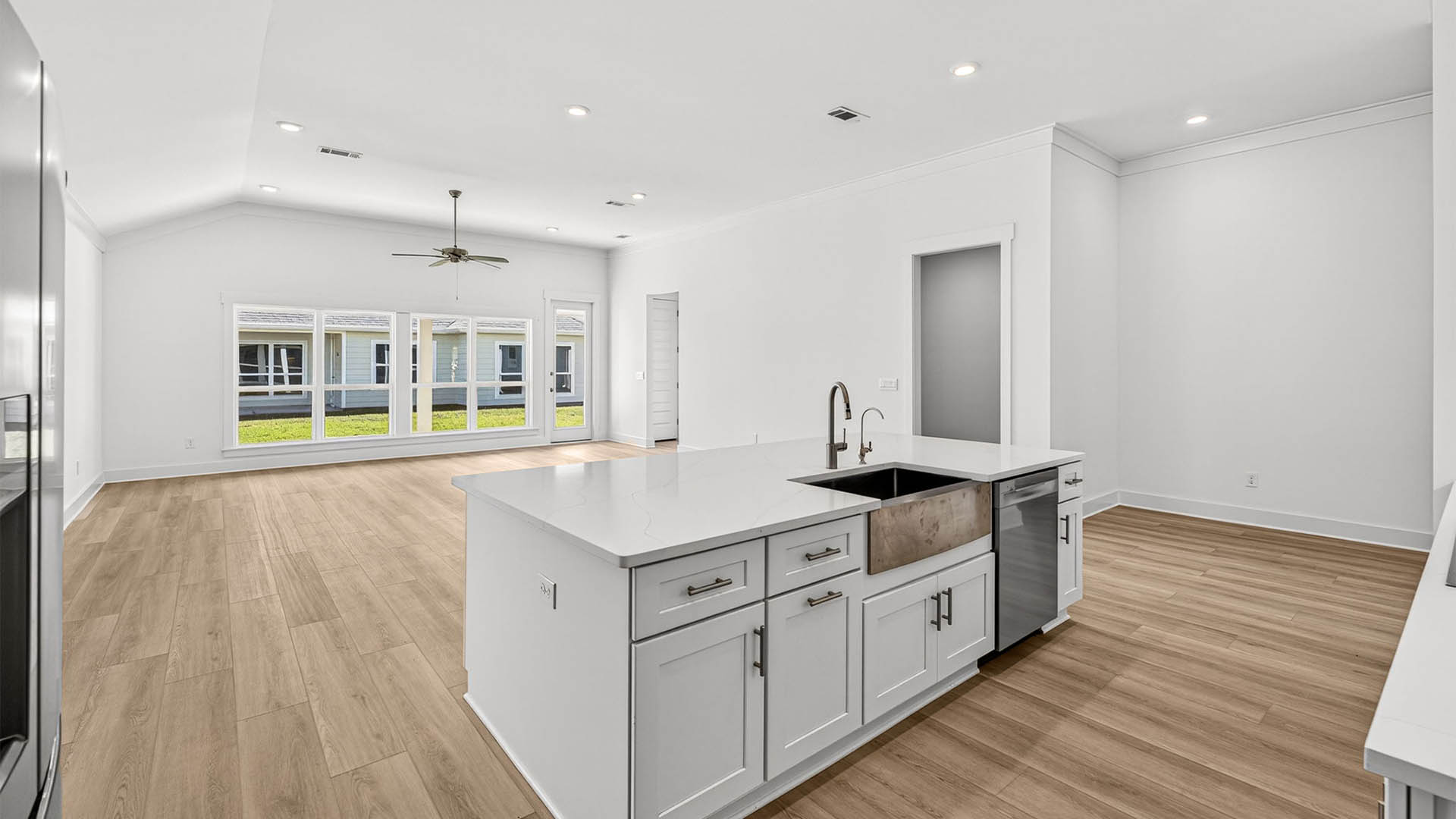 Open living room and kitchen with kitchen island.
