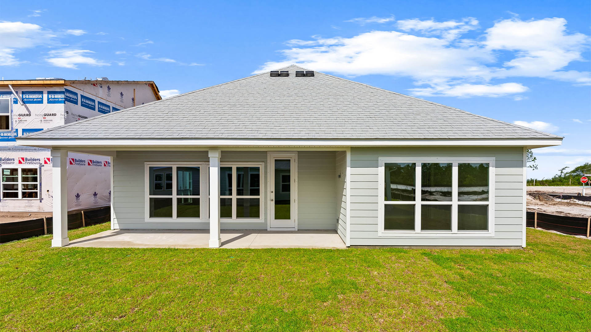Jubilee plan rear of home with covered patio.