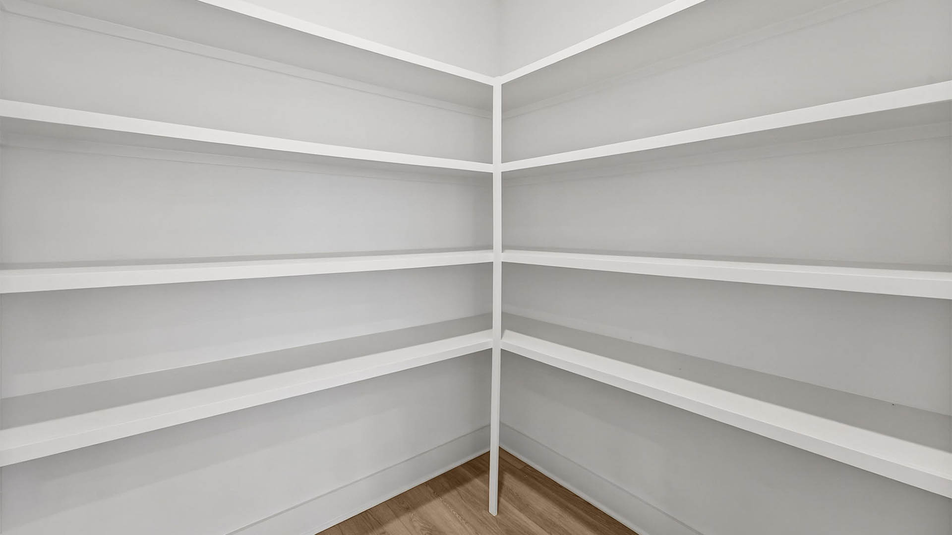 Pantry with wooden shelving.