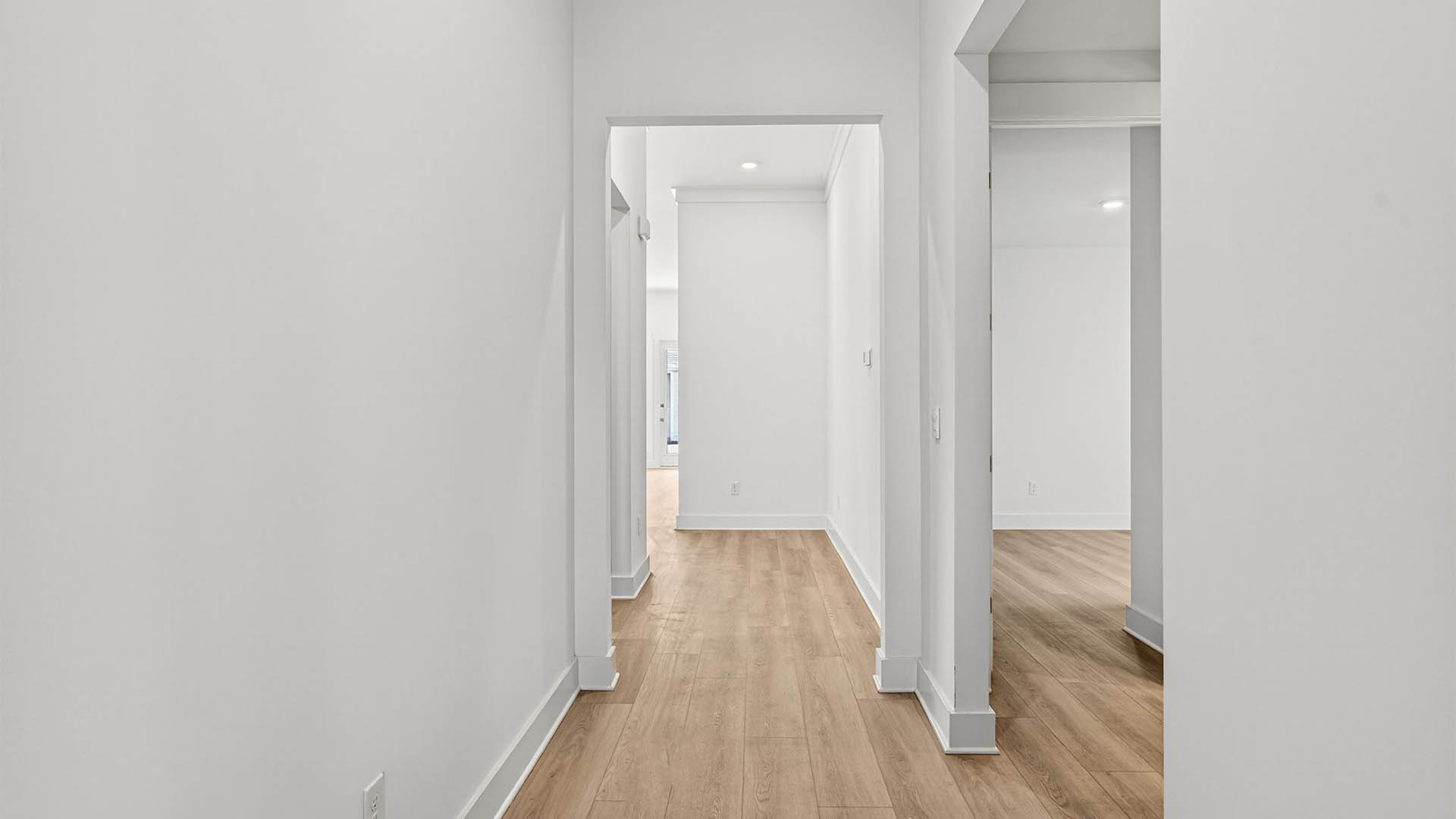 Front entrance hallway with EVP flooring next to bedrooms.