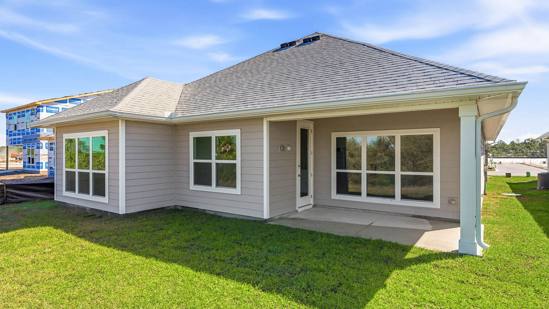 Lily plan rear of home with covered patio.