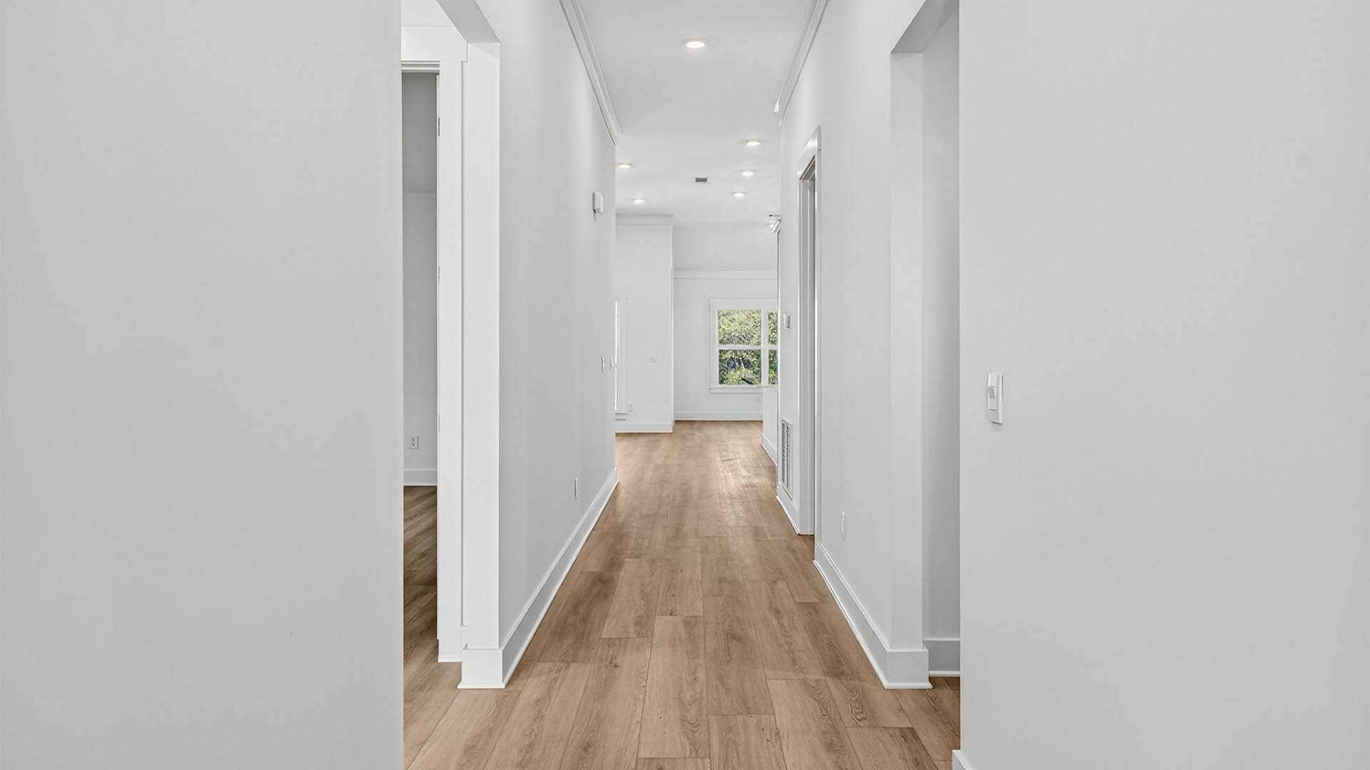 Front entrance hallway with EVP flooring next to bedrooms.