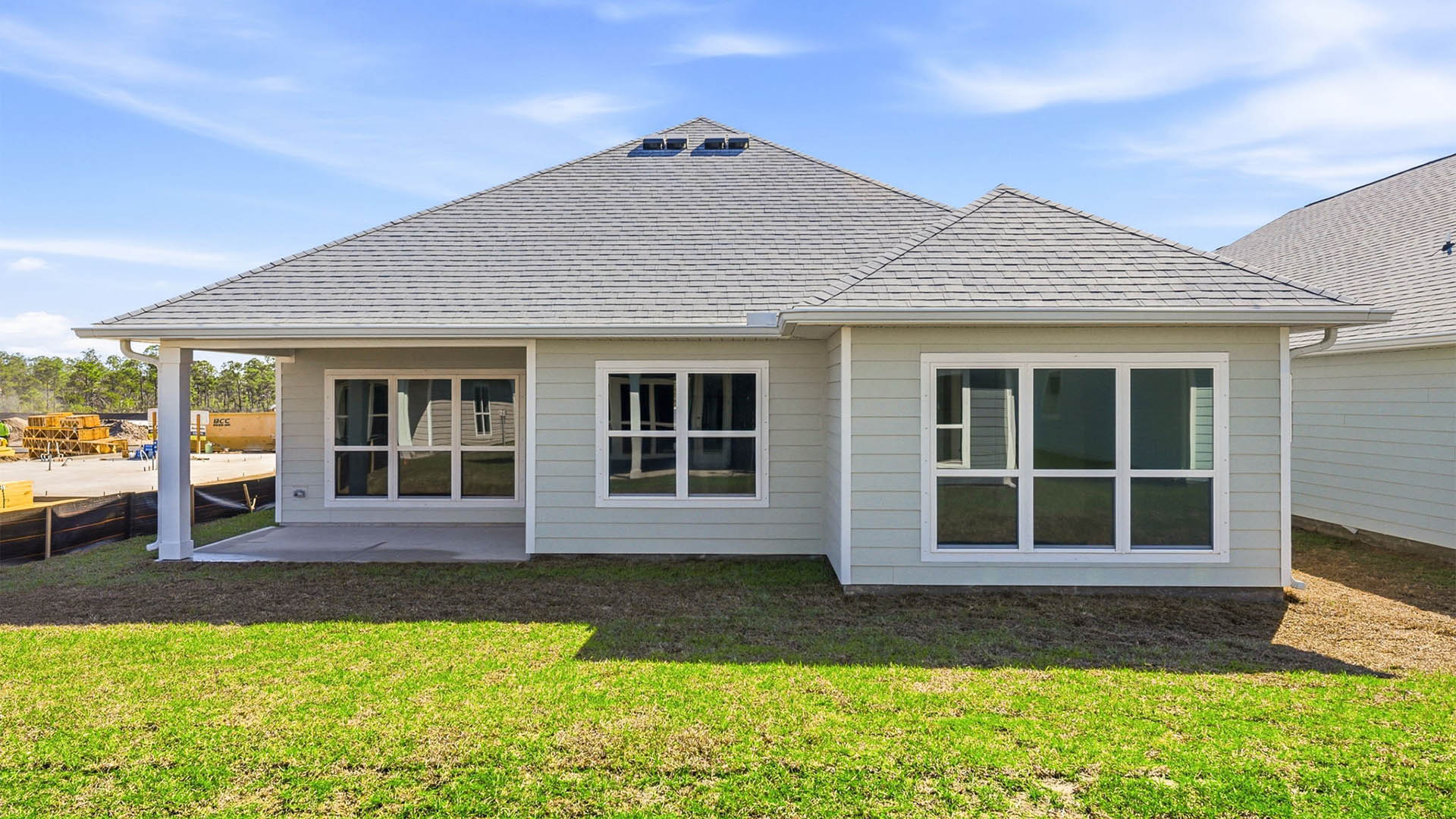 Lily plan rear of home with covered patio.