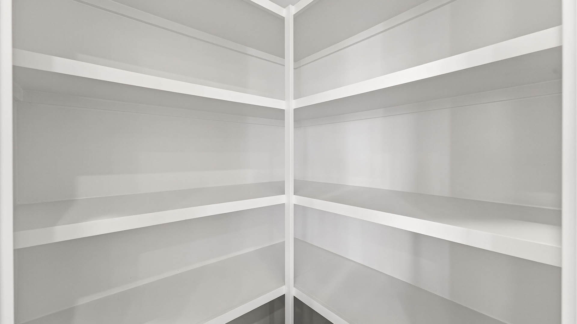 Pantry with wooden shelving.