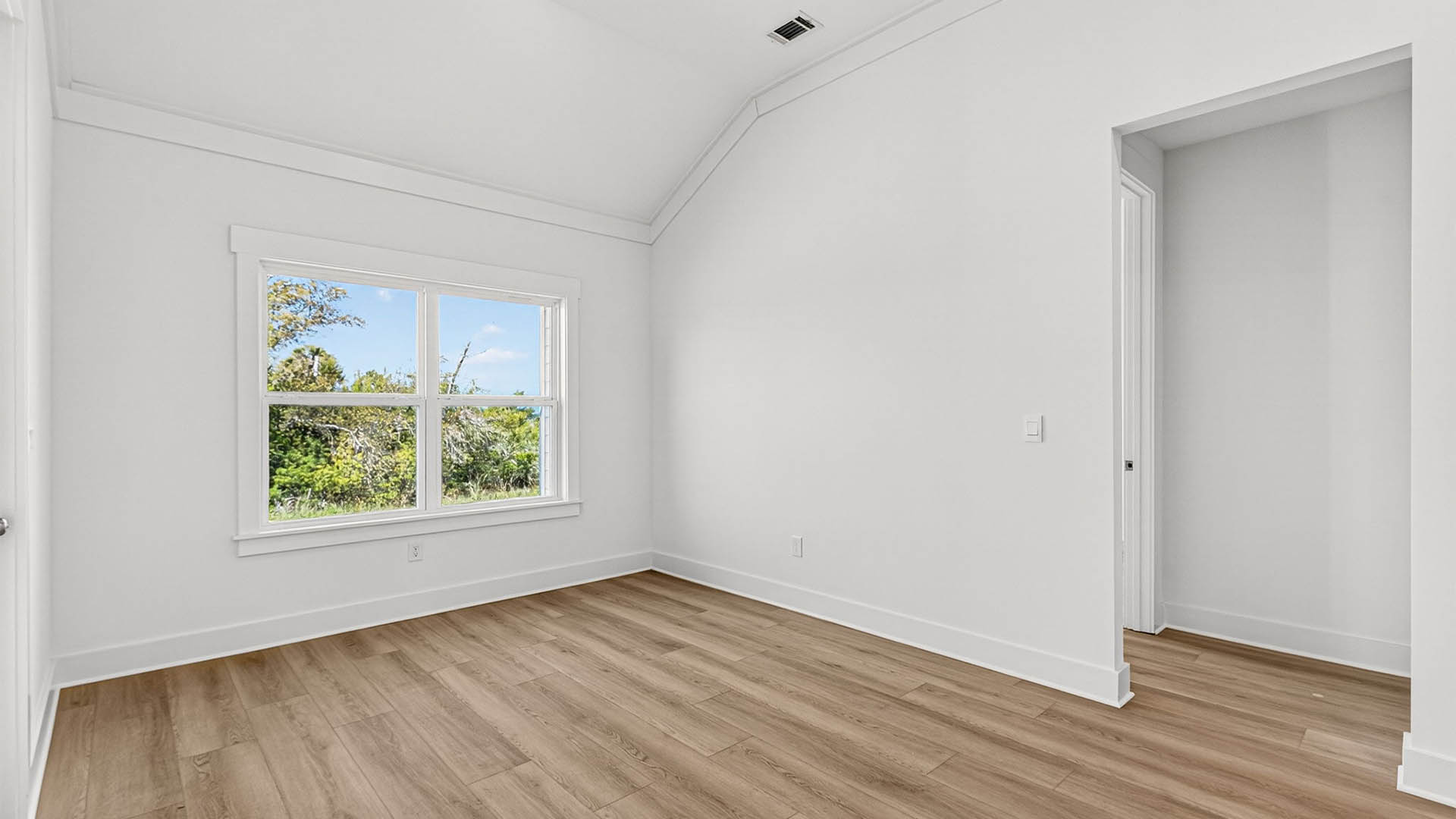 Dining area next to back door and bedrooms.