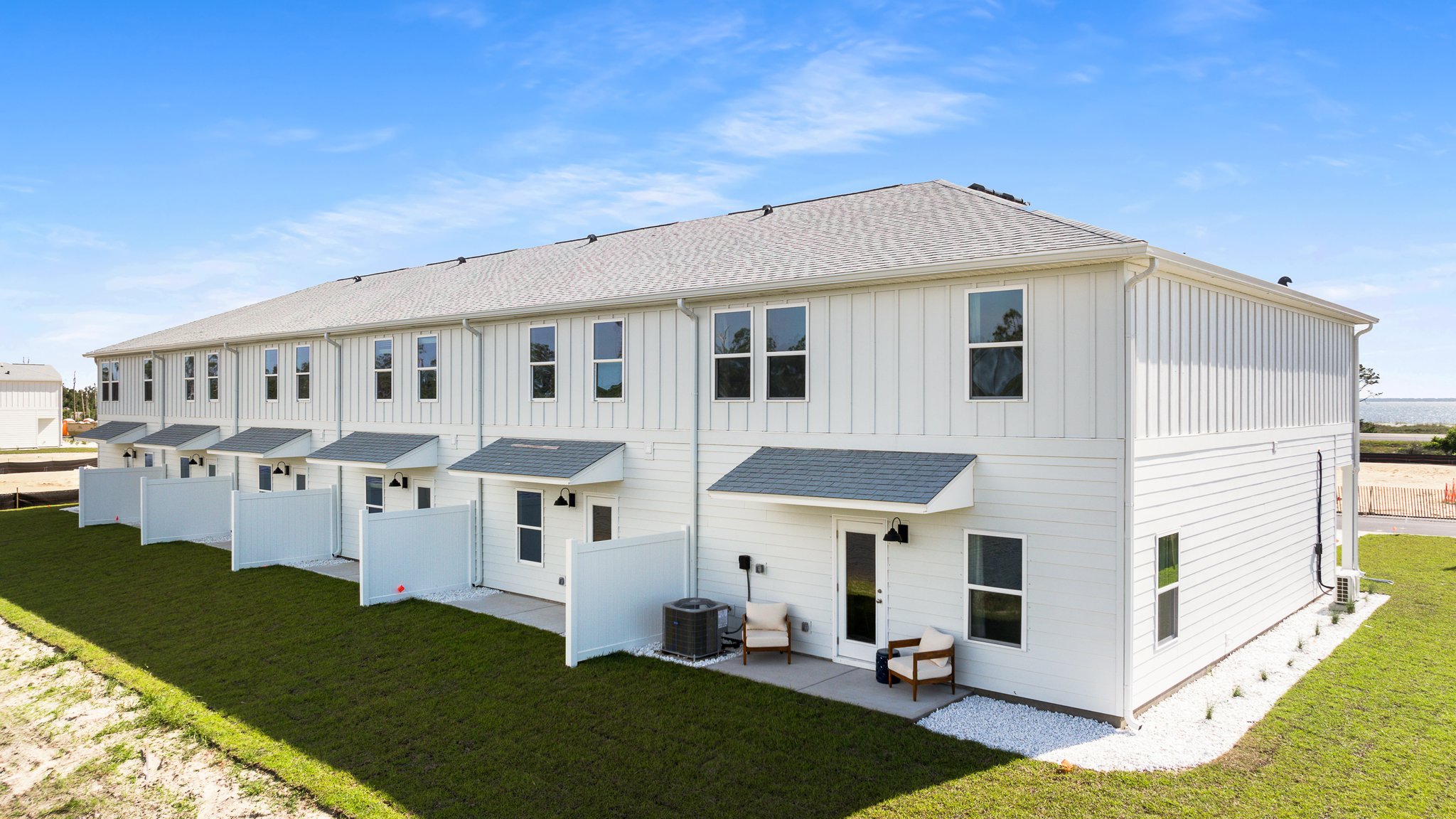 Sabal Townhome units rear of home with covered patios and partitions.