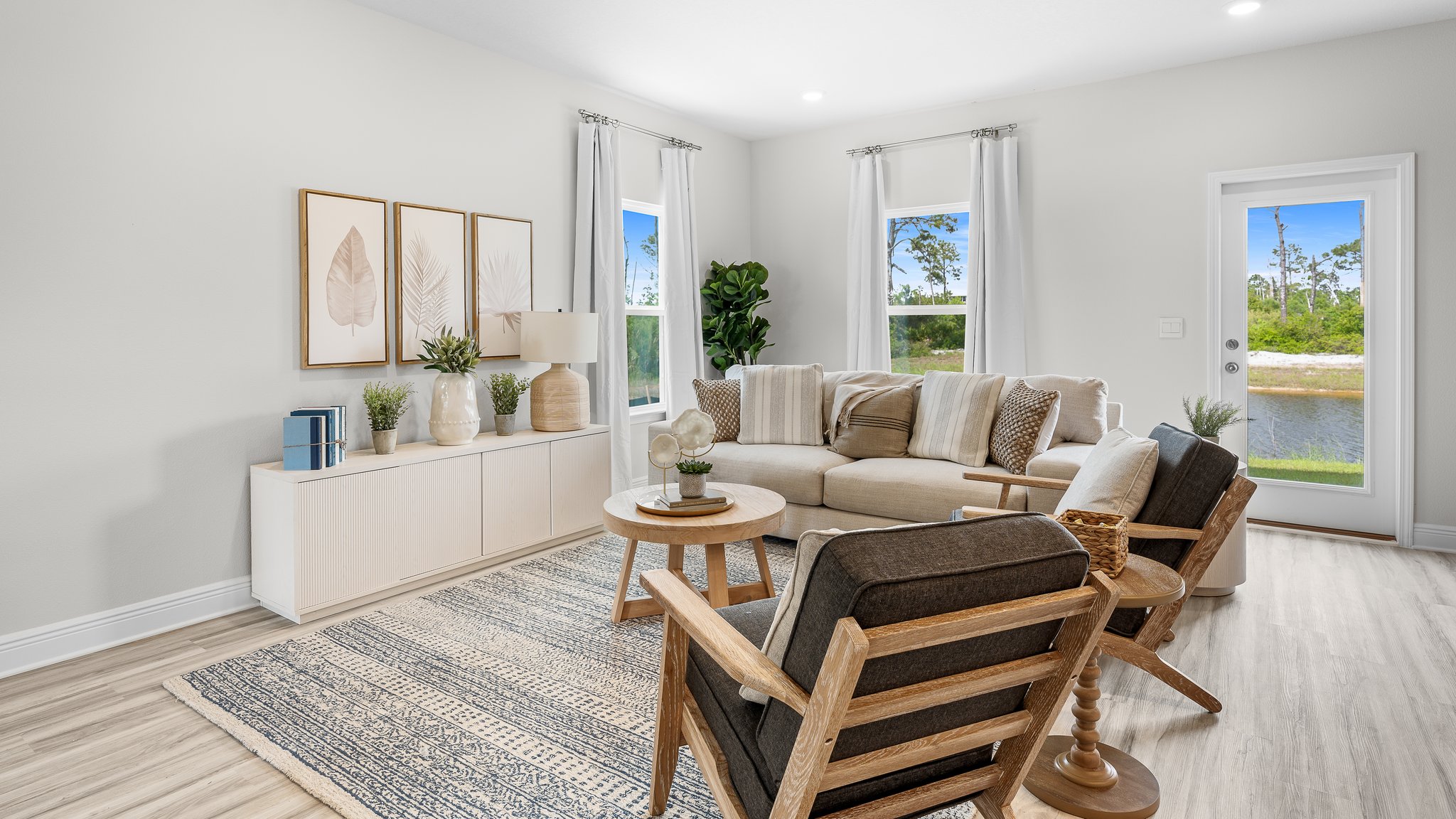 Open living room with EVP flooring and windows.