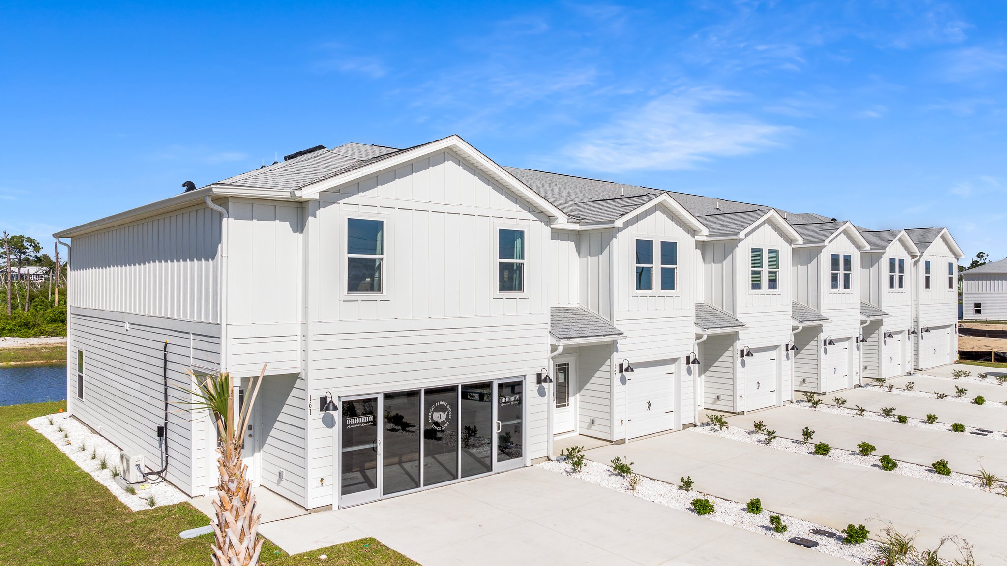 Sabal Townhome units at WindMark Beach with Hardie Board siding and one and two car garages.