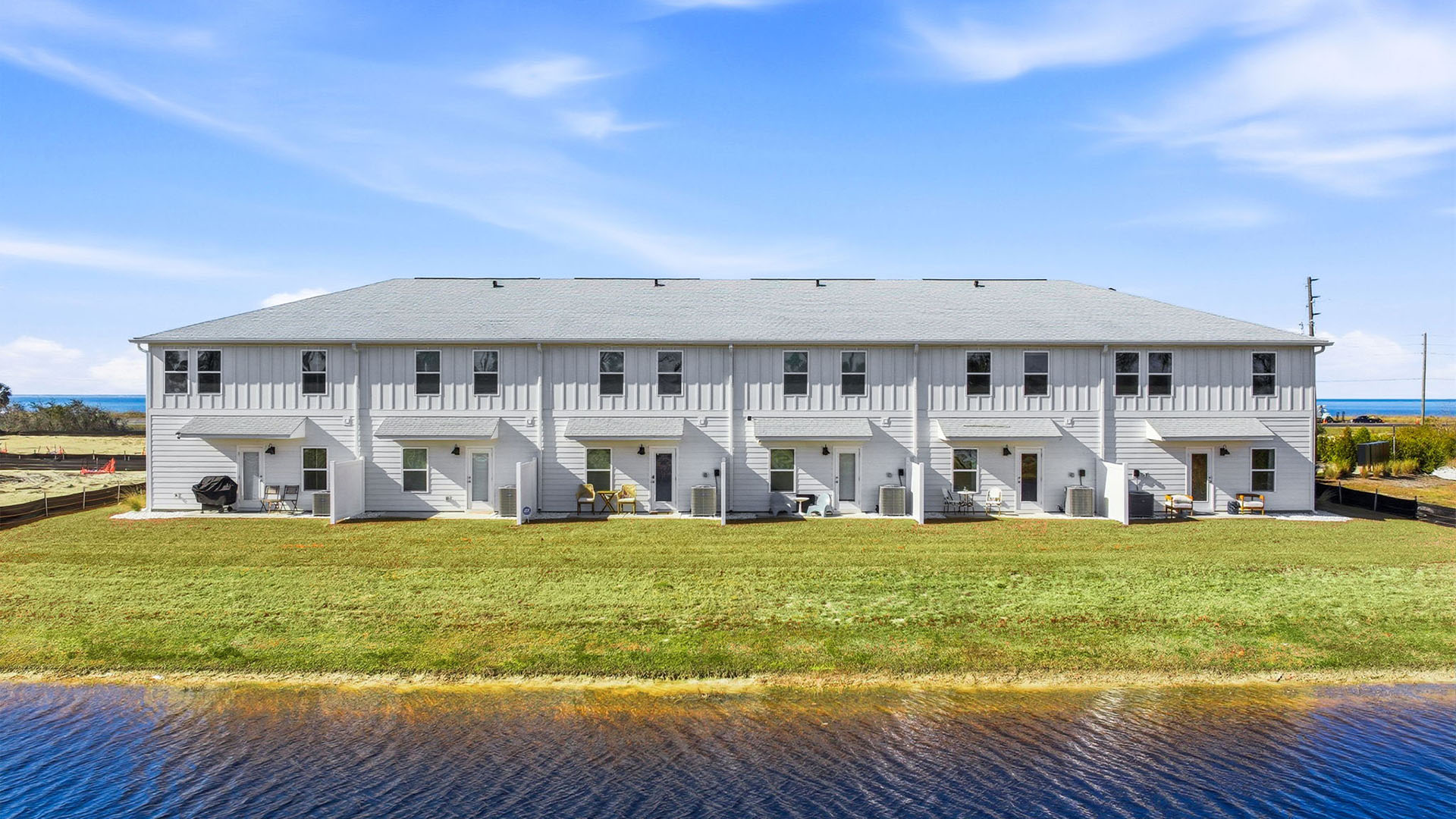 Sabal Townhome units rear of home with covered patios and partitions.