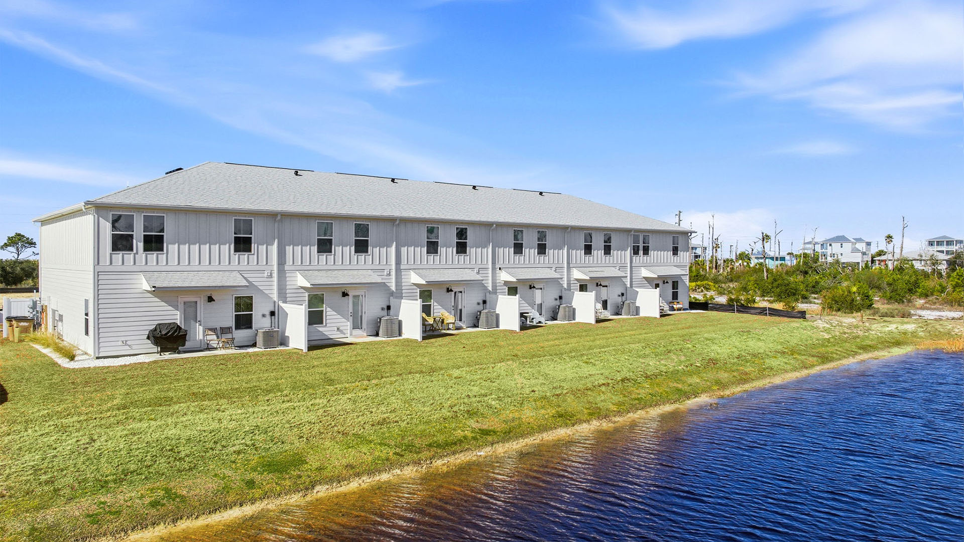 Sabal Townhome units rear of home with covered patios and partitions.