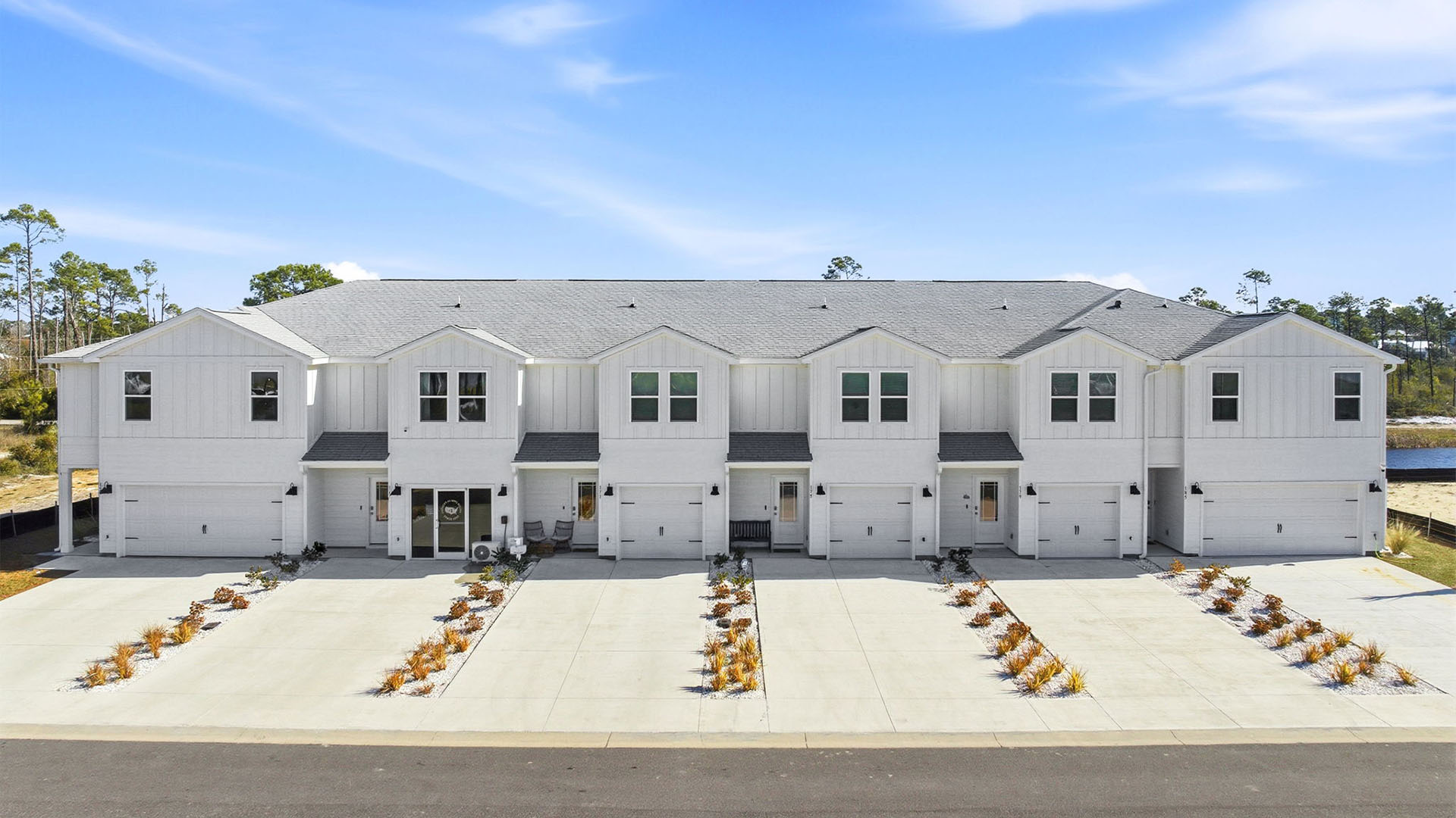 Sabal Townhome exterior unit at WindMark Beach with Hardie Board siding and two car garage.