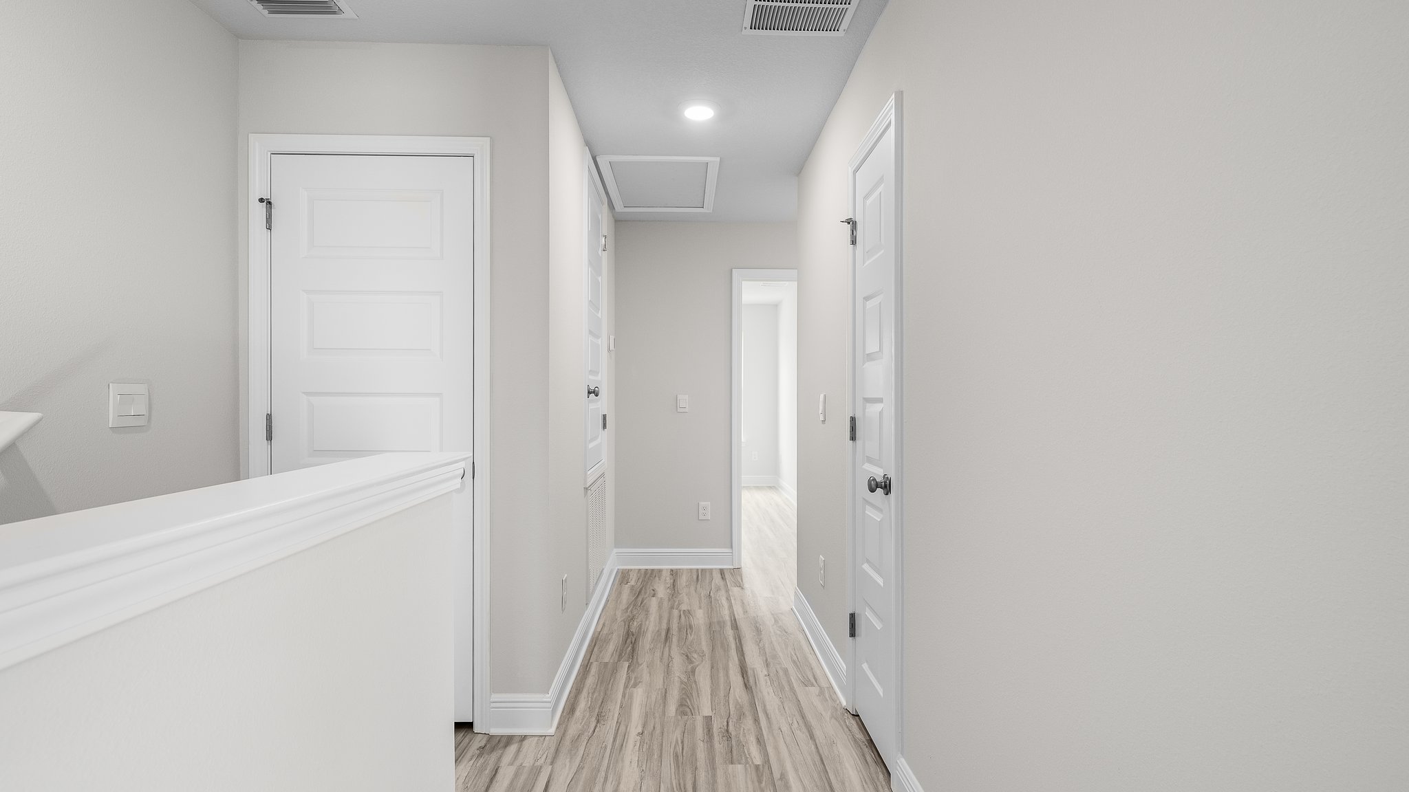 Upstairs foyer showing bedrooms and bathrooms.