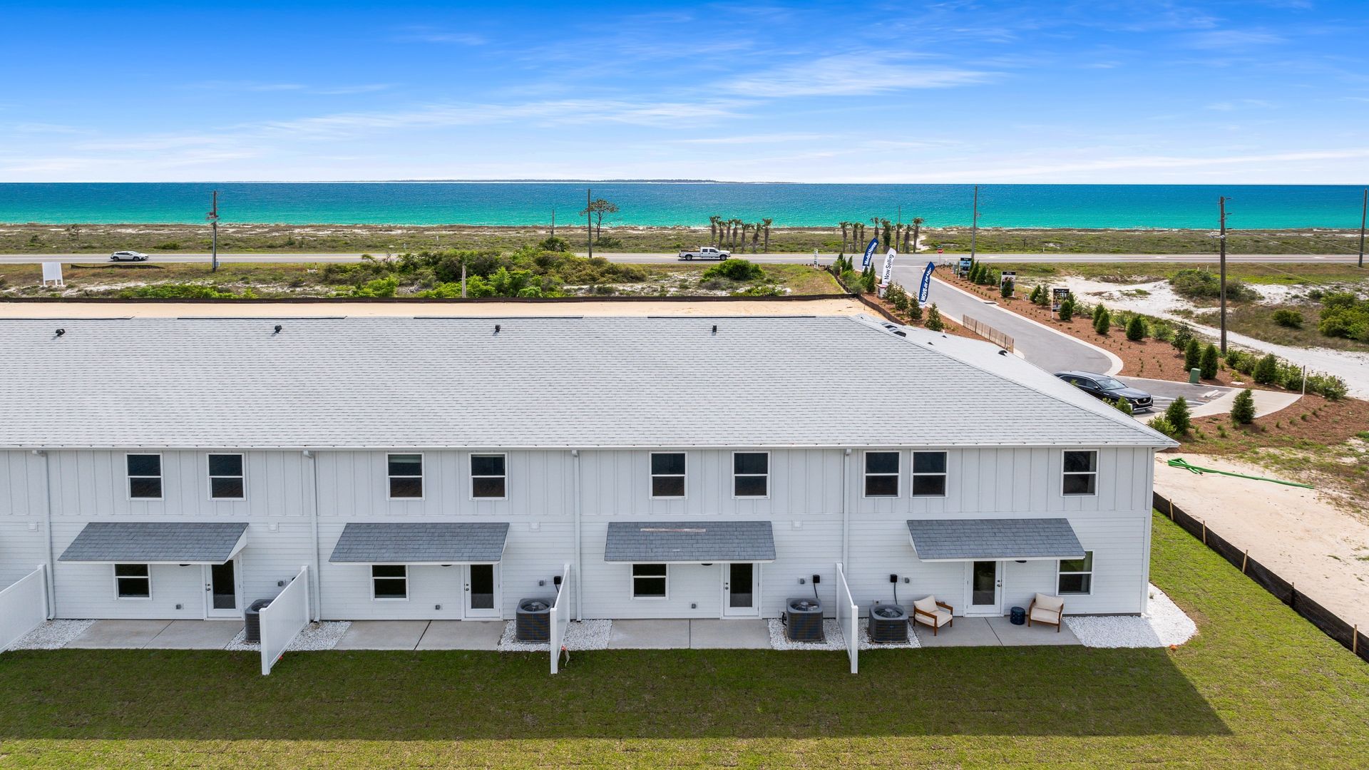 Sabal Townhome units rear of home with covered patios and partitions.