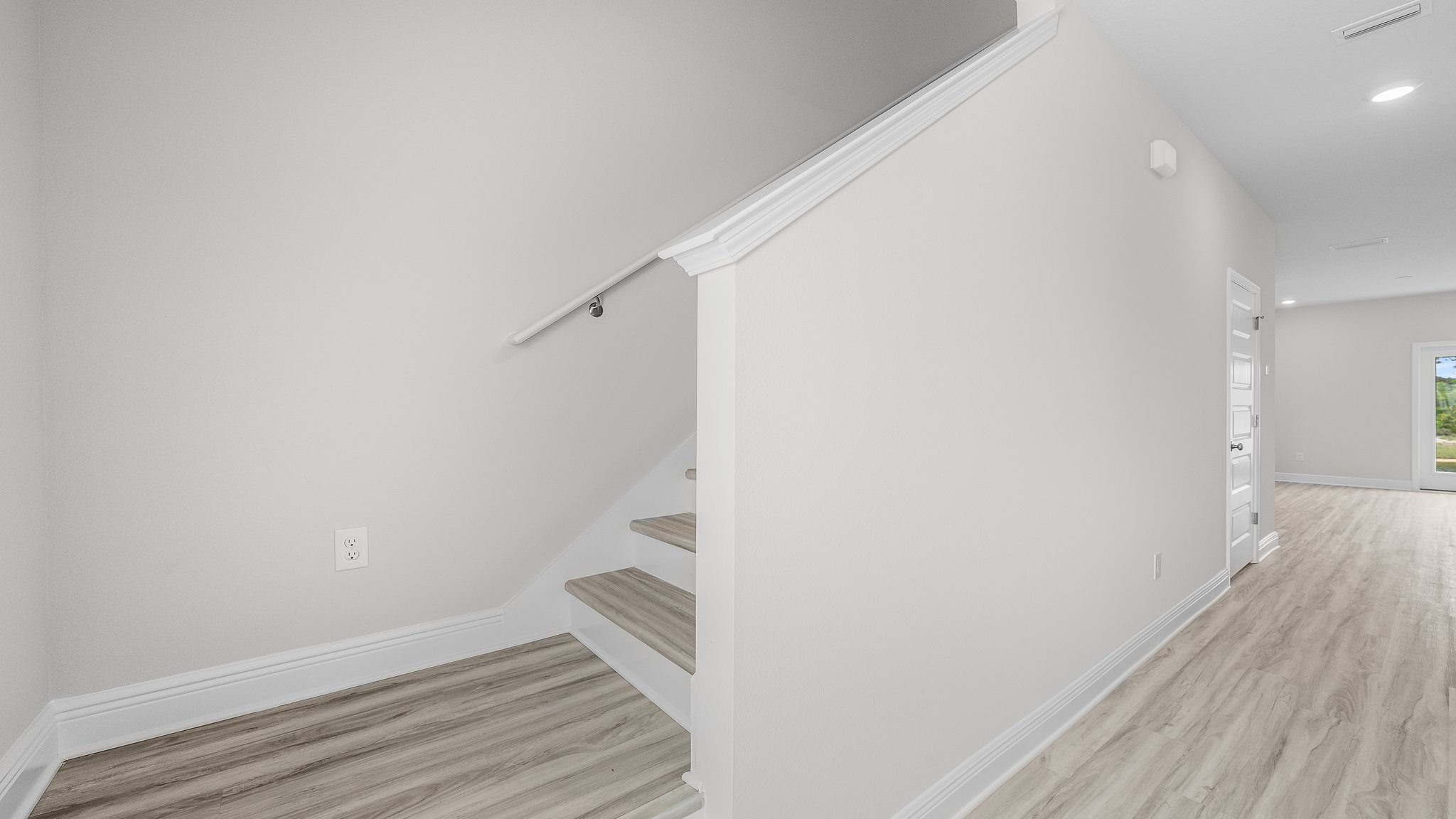 Front entrance hallway next to stairs.