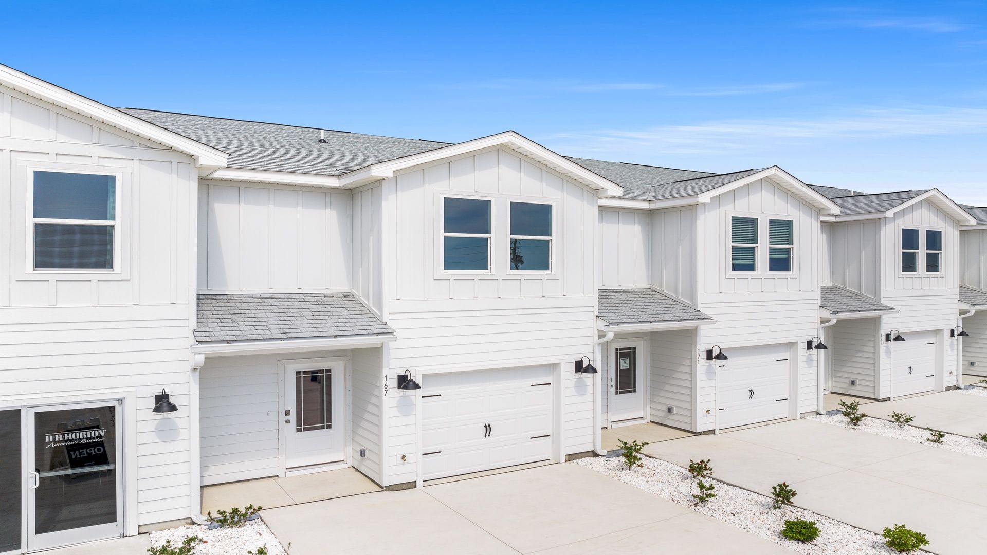Sabal townhome interior unit with Hardie board siding and single car garage.