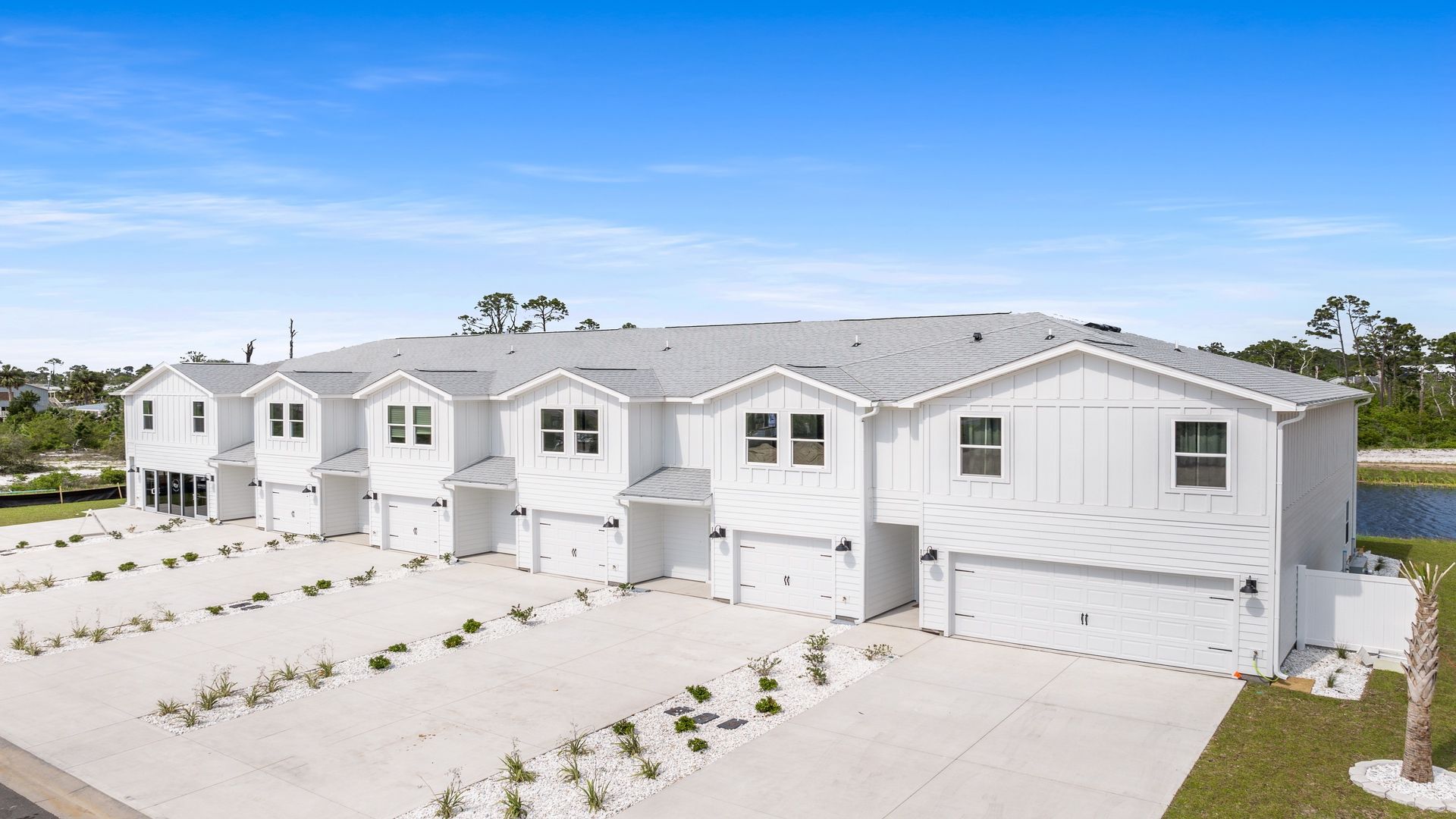 Sabal Townhome units at WindMark Beach with Hardie Board siding and one and two car garages.
