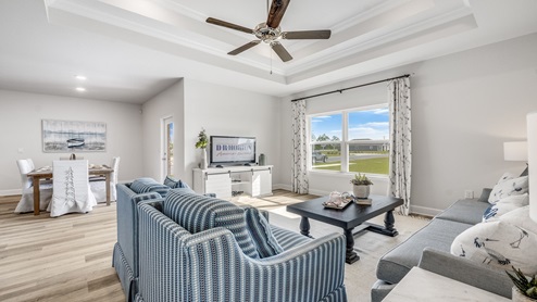 Hodges Bayou Plantation model home living room with tray ceilings.