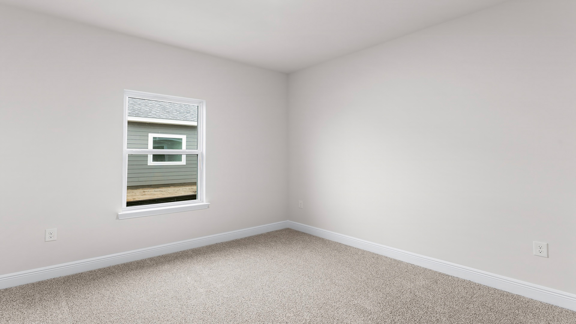 Bedroom with carpet floors and window.