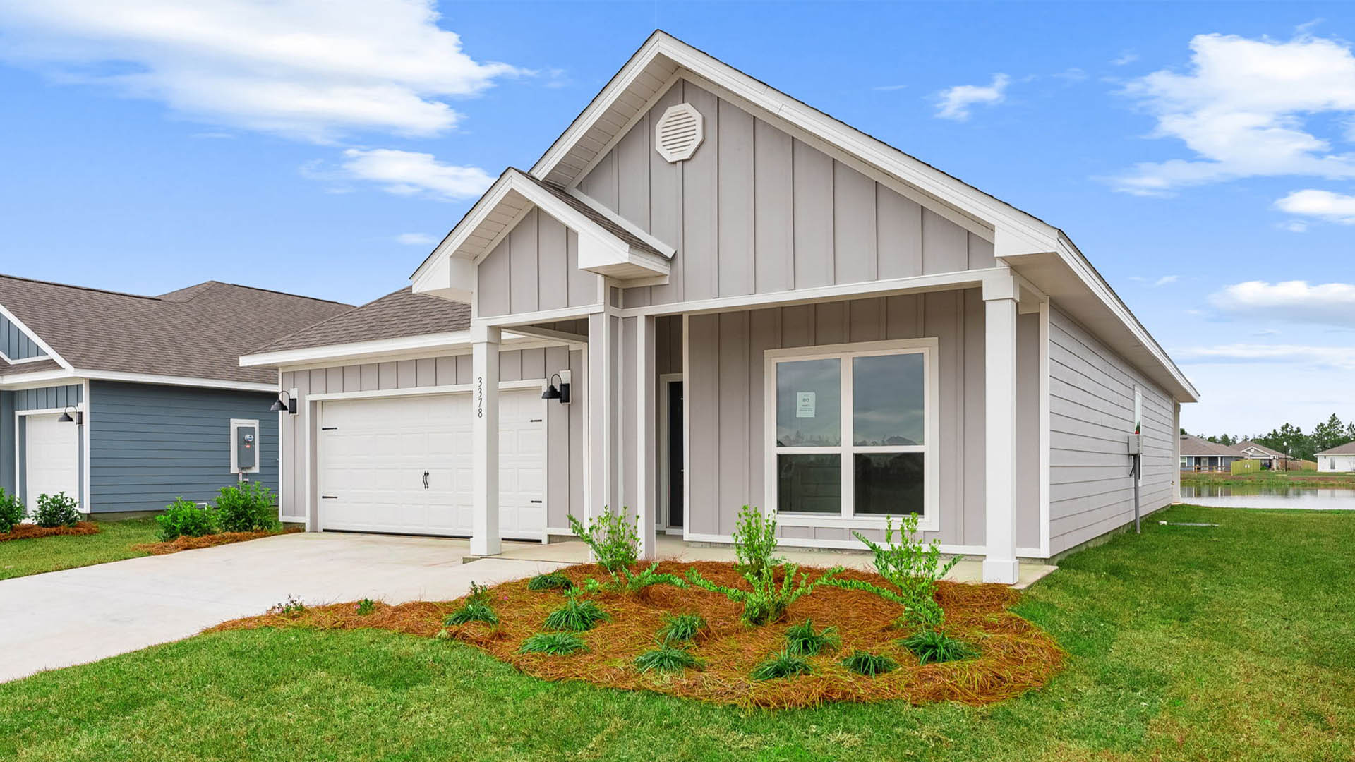 Rhett floor plan at Hodges Bayou Plantation with two car garage and covered front porch and Hardie Board siding.