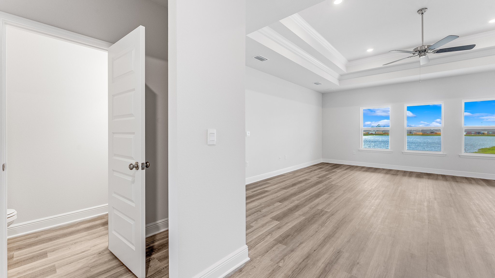 Hallway living room entrance next to bathroom.