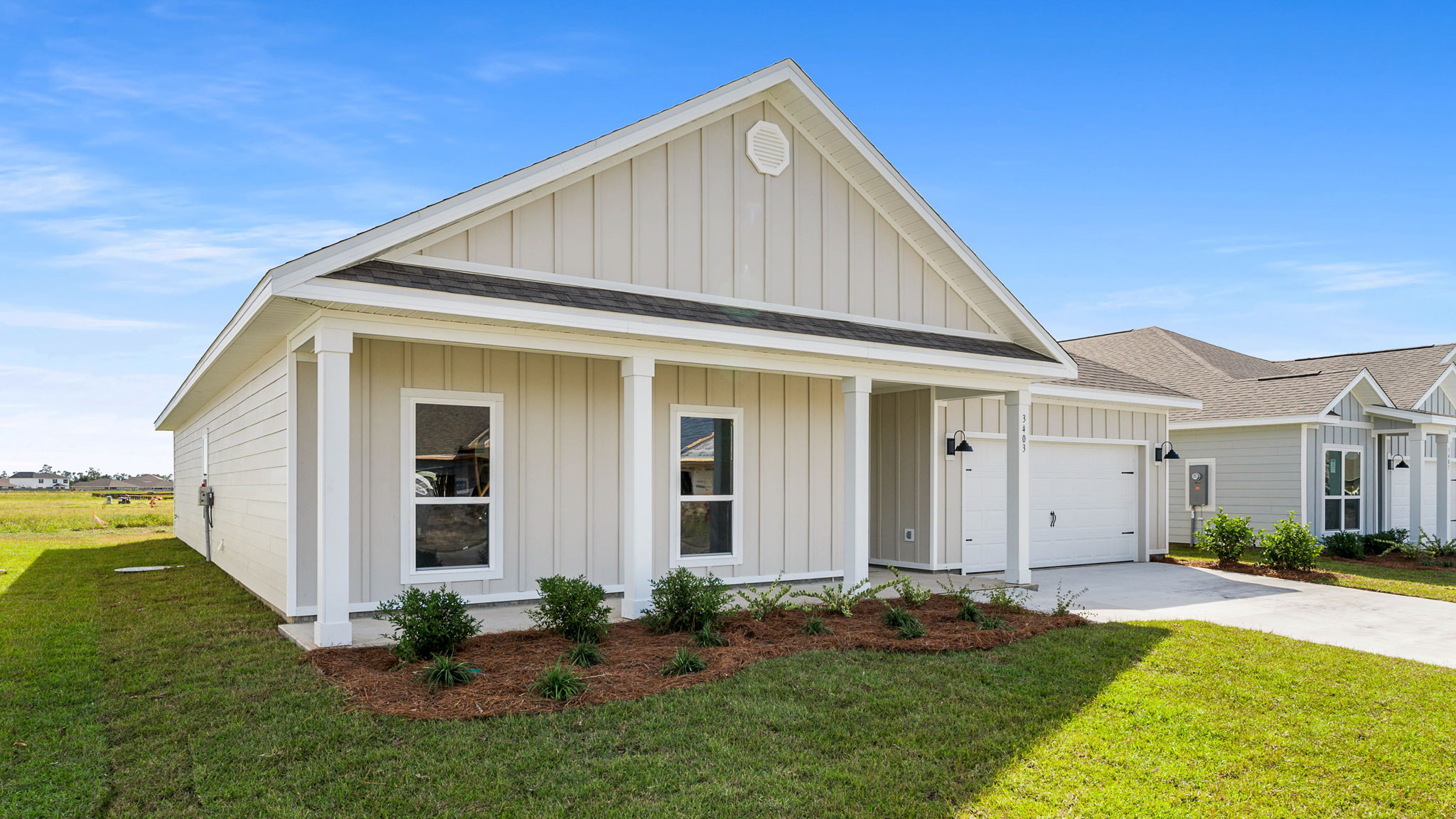 Victoria floor plan at Hodges Bayou Plantation with Hardie Board siding and large covered front porch and two car garage.