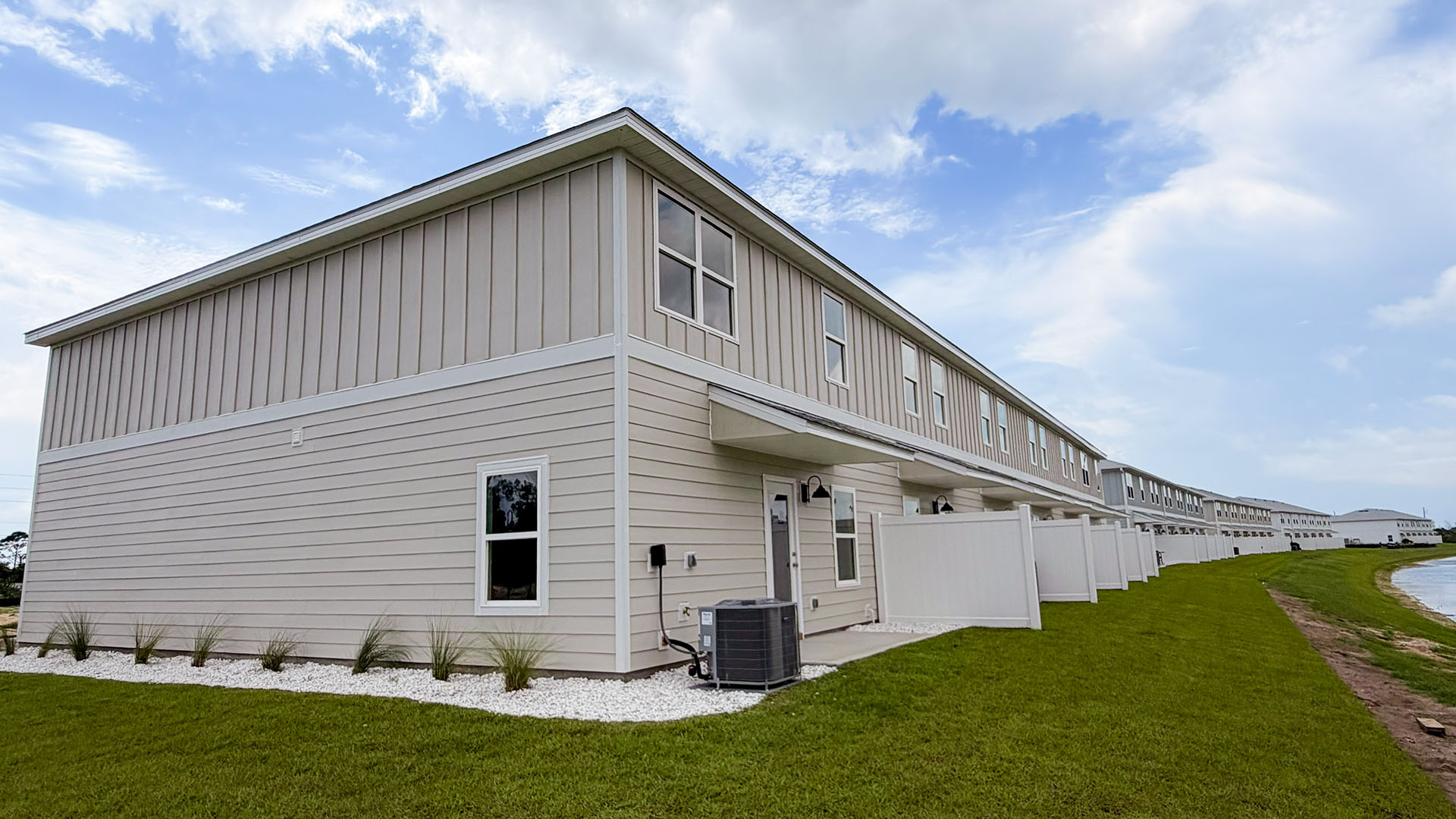 Sabal Townhome units rear of home with covered patios and partitions.