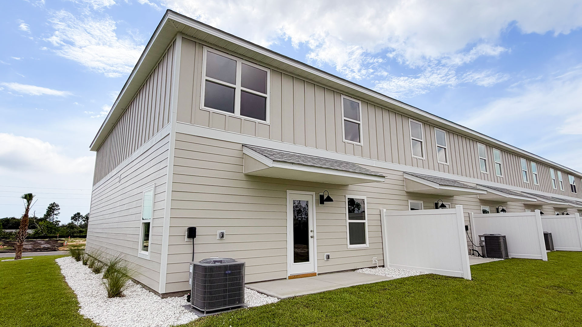 Sabal Townhome units rear of home with covered patios and partitions.