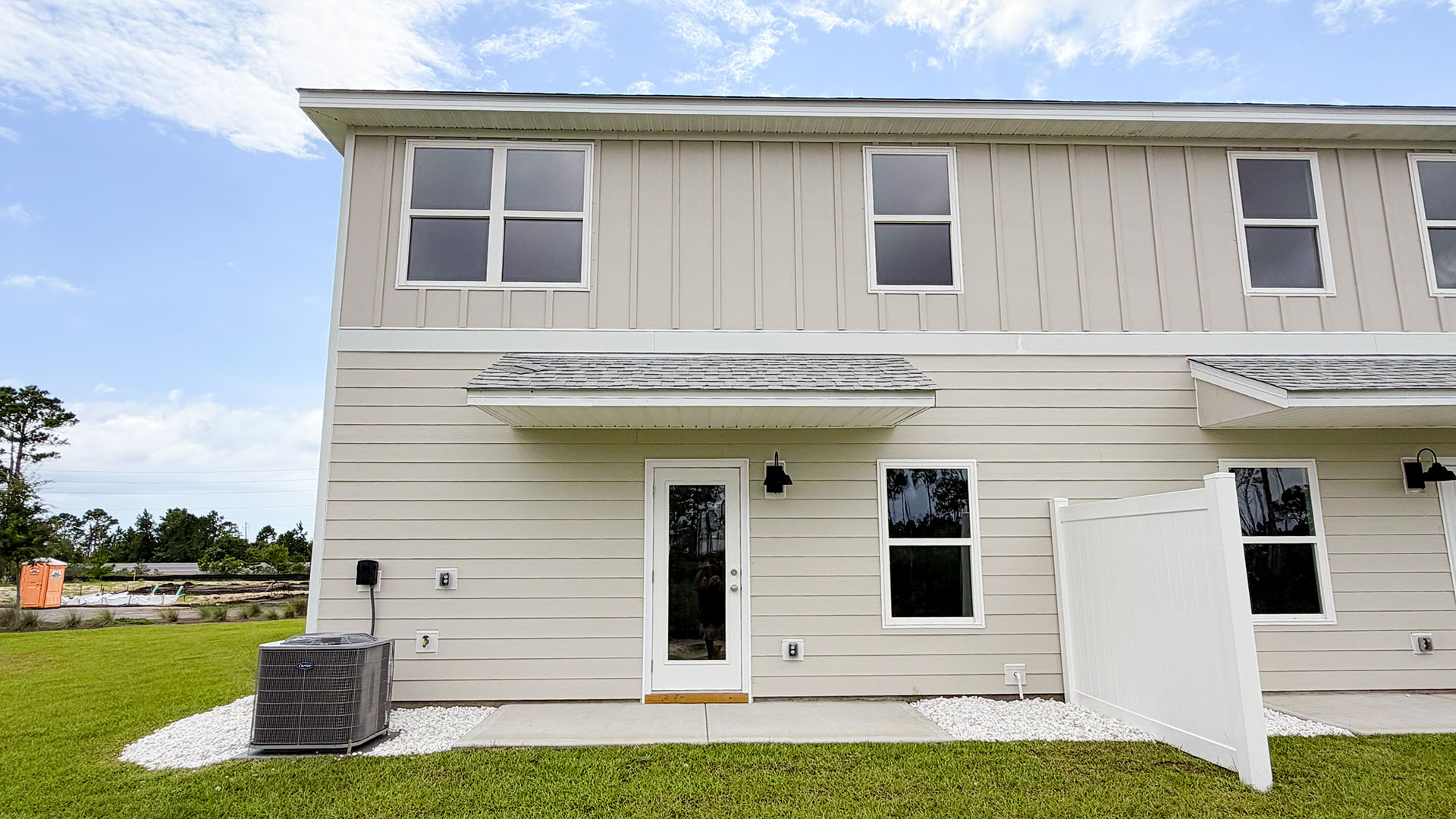 Sabal Townhome units rear of home with covered patios and partitions.