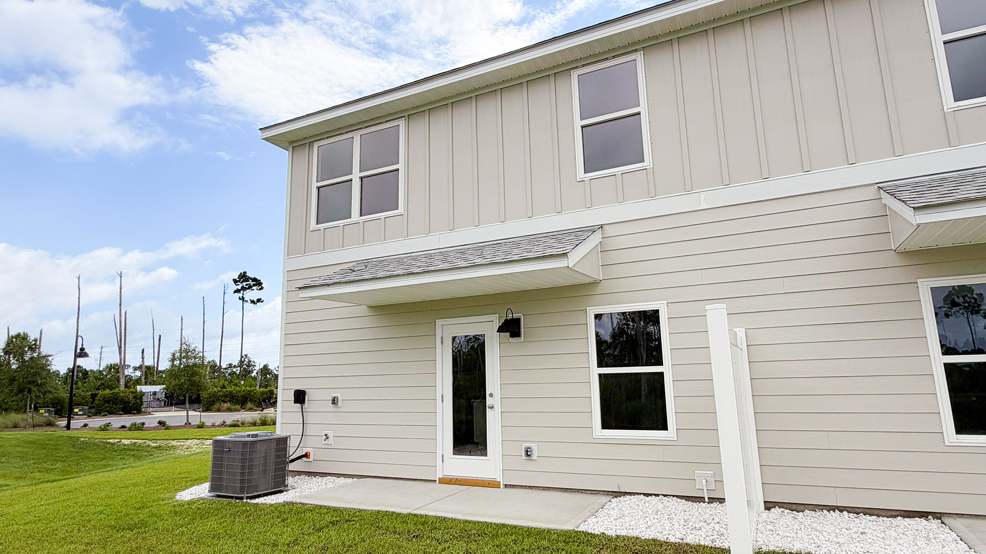 Sabal Townhome units rear of home with covered patios and partitions.