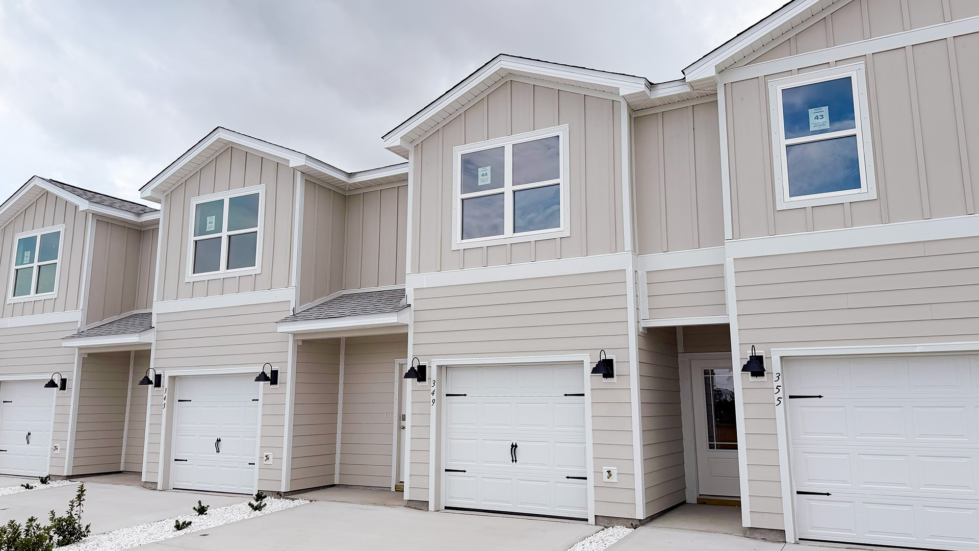 Sabal townhome interior unit with Hardie board siding and single car garage.